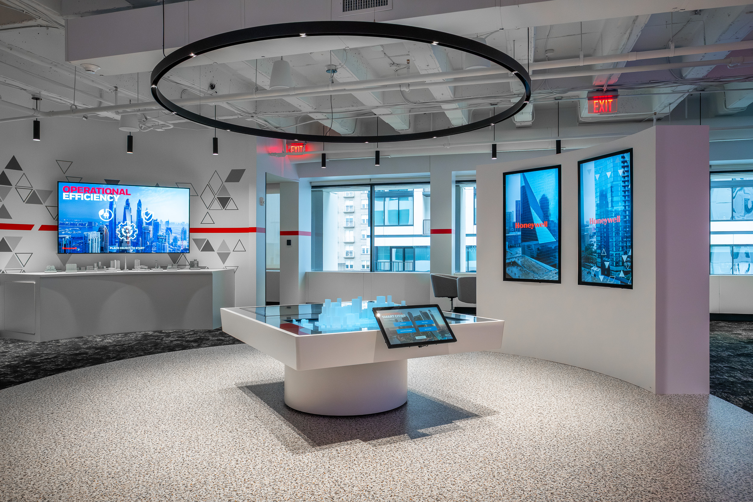 Honeywell showroom with glowing blue city model and digital displays