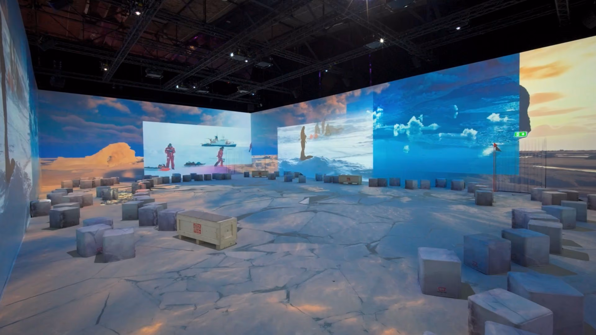 Immersive polar exhibition with icy landscapes projected across curved walls