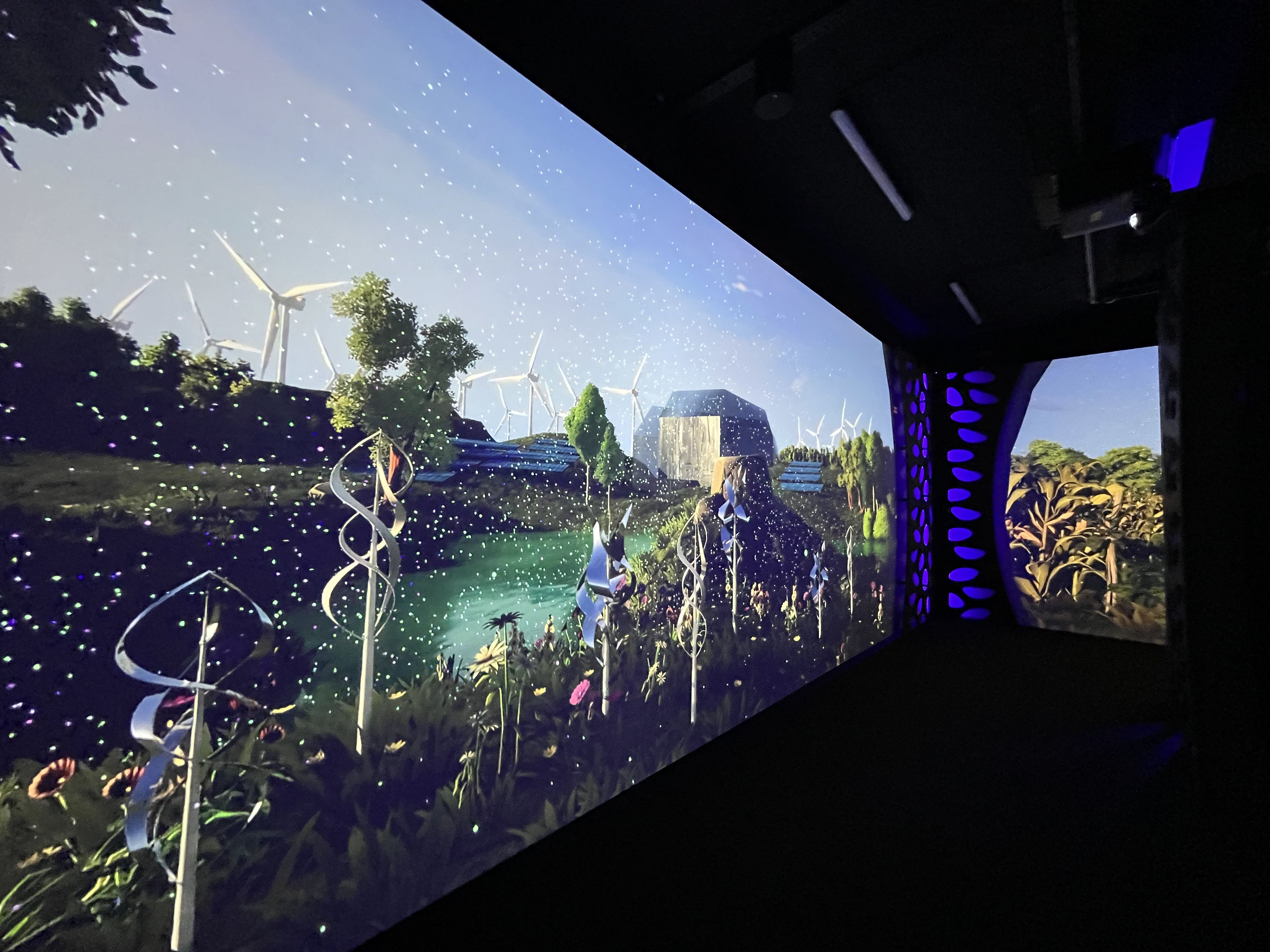 Visitors moving through three industrial revolutions on projections