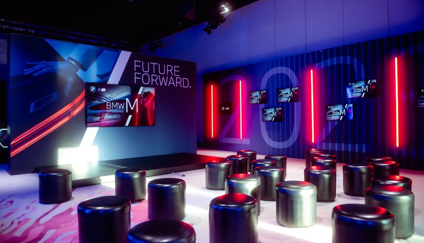 BMW showroom with Future Forward display and vertical red neon bars