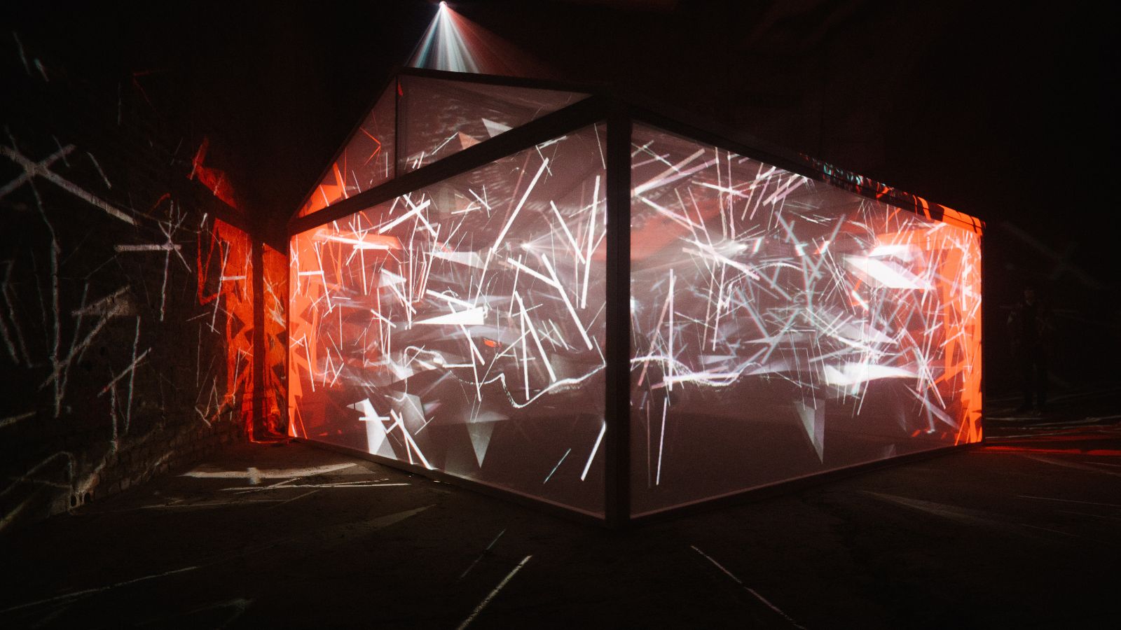 House-shaped frame glows red with chaotic white geometric projections