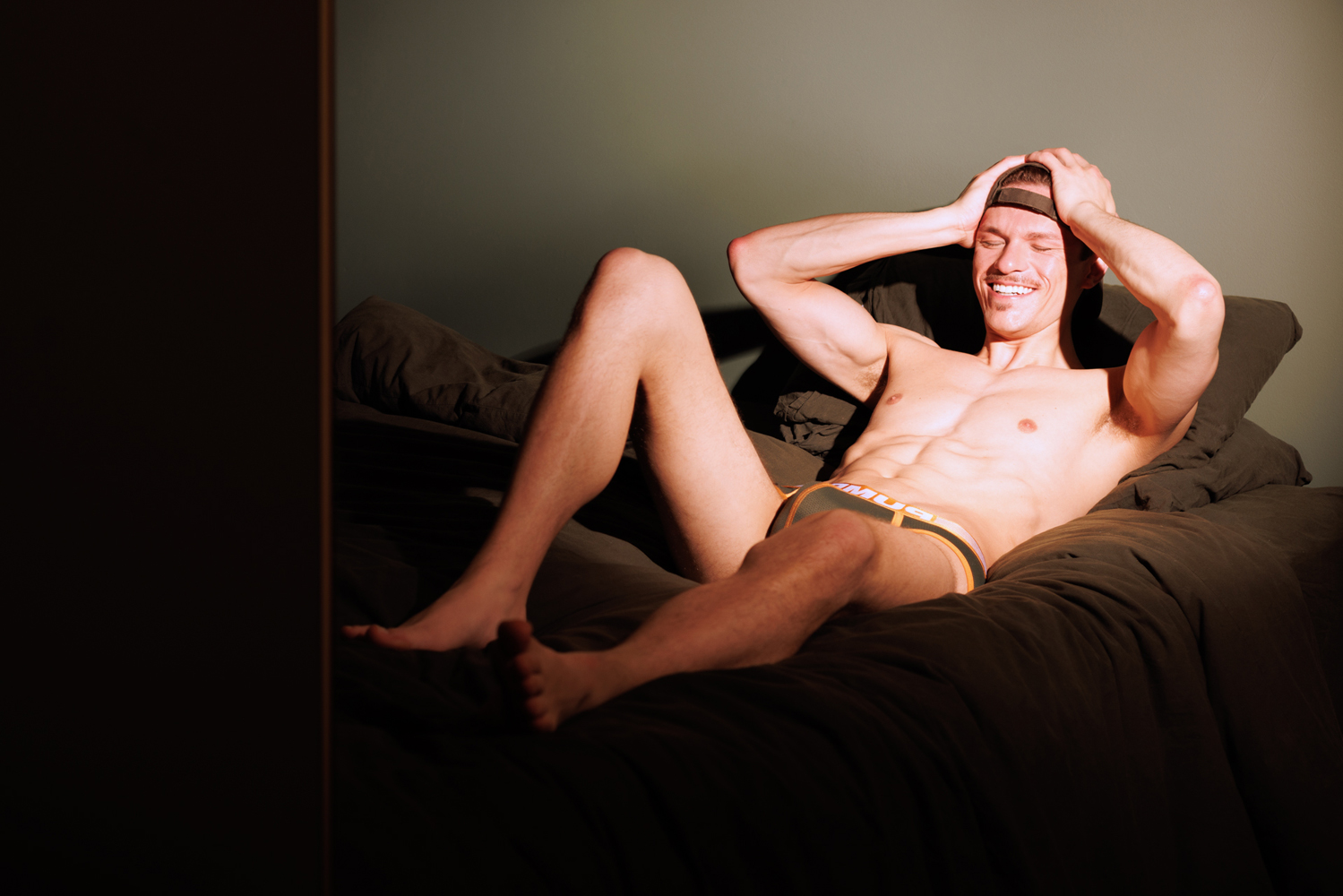 a man lying on a bed