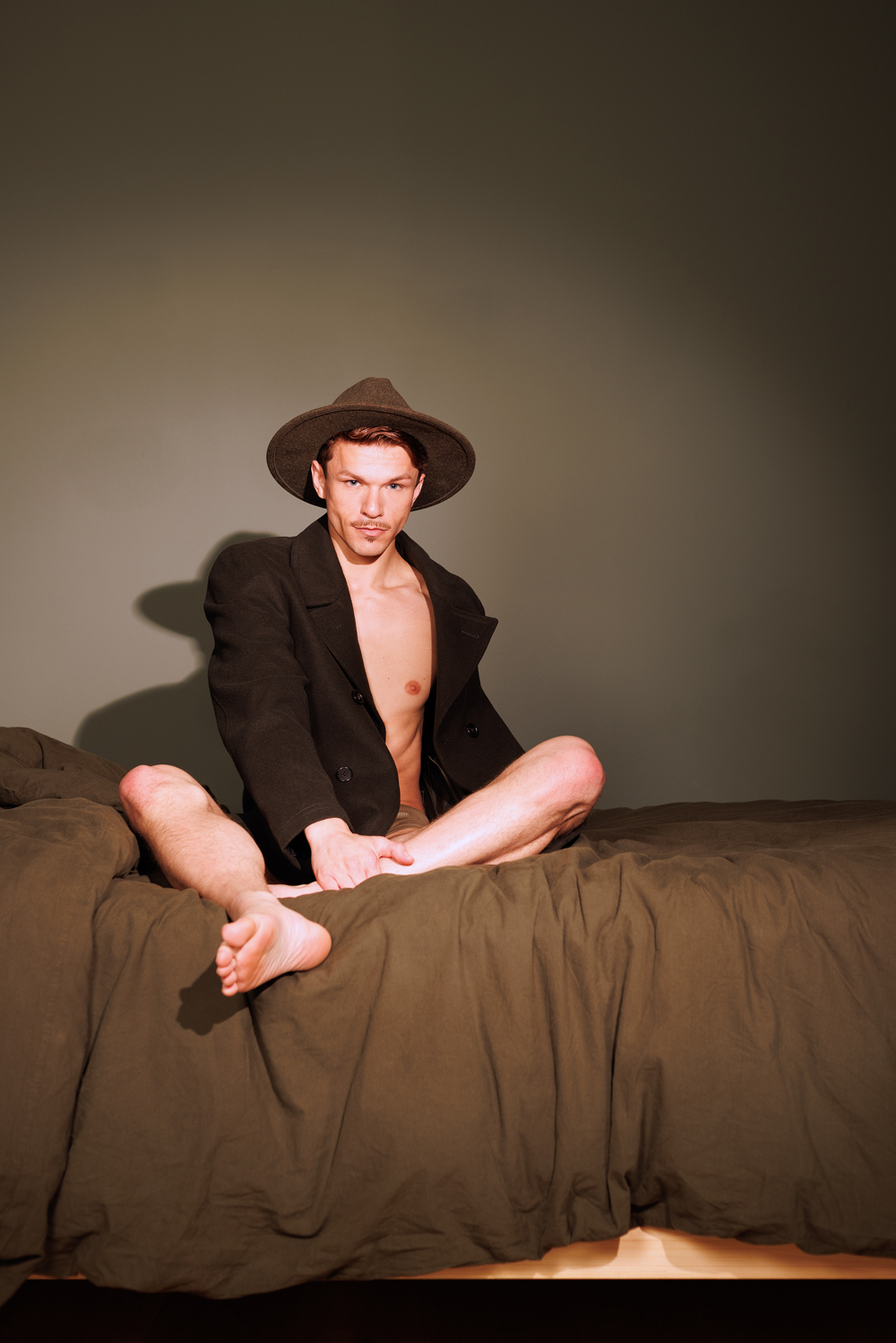 a man sitting on a bed