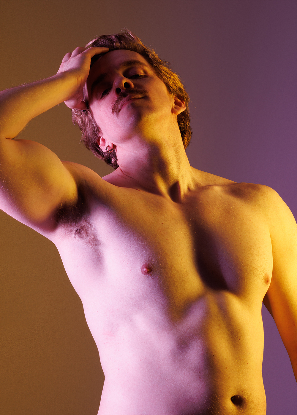 a man with his hand on his head