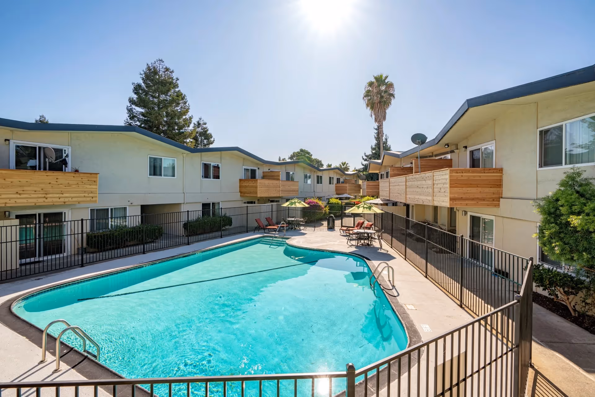Exterior community amenity area featuring view of swimming pool