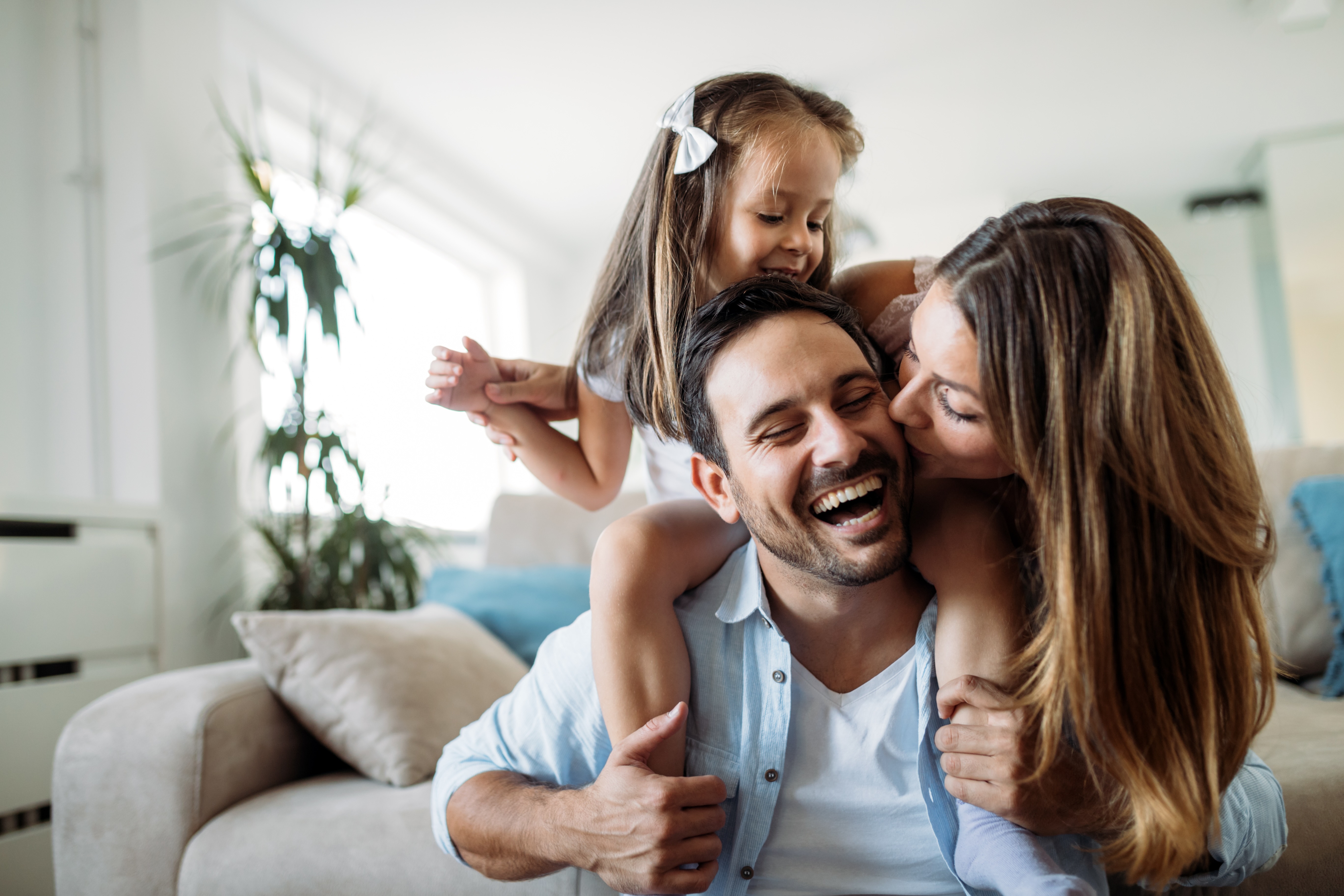 Mom, dad and daughter smiling stock image