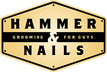 Hammer & Nails grooming for guys logo in a gold hexagonal badge.