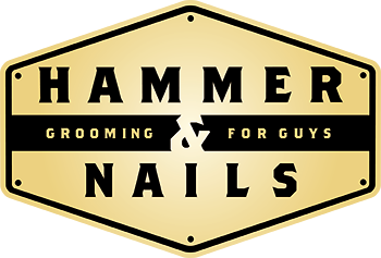 Hammer & Nails grooming for guys logo in a gold hexagonal badge.