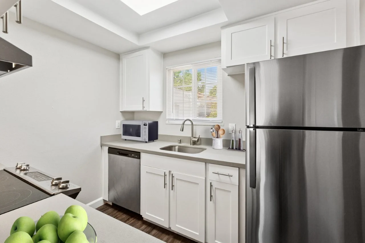 Kitchen with white cabinets and stainless steel appliances