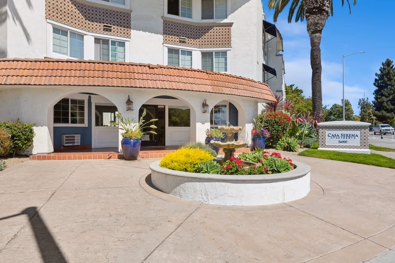 Exterior of apartments featuring bbq area and pool