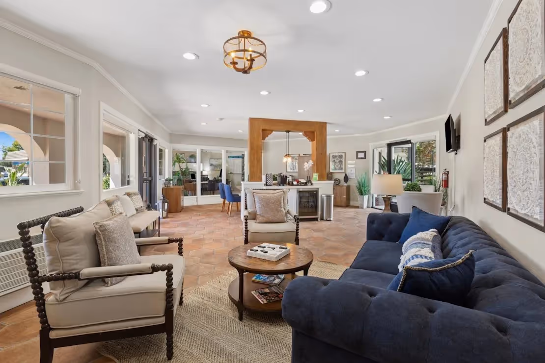 Clubhouse with sofa, coffee table, and coffee bar