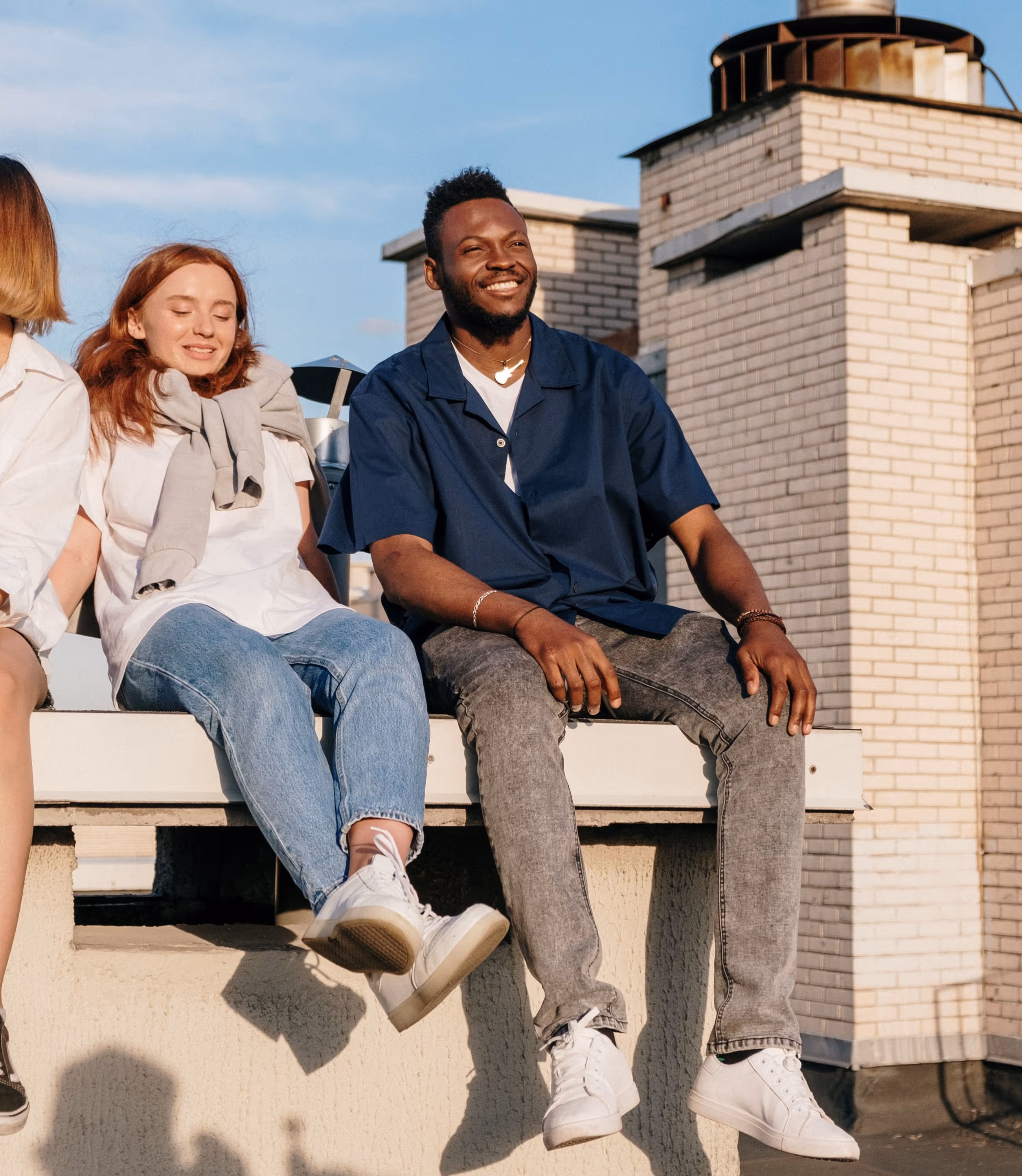 Friends sitting in sun stock image