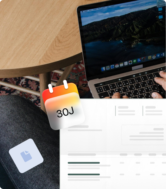 Person typing on a laptop on a wooden table with digital icons of calendar showing 30J and a document.
