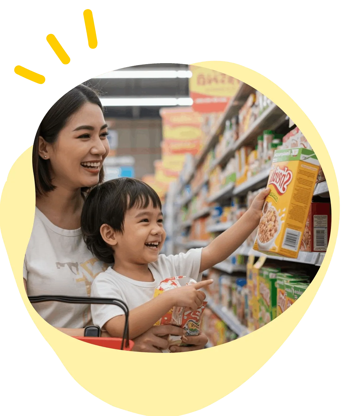 Smiling woman and child shopping, child holding and pointing to cereal box in grocery aisle.