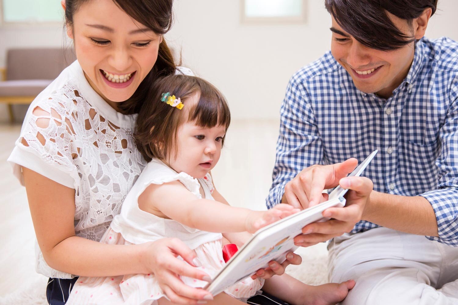 Parent playing with infant