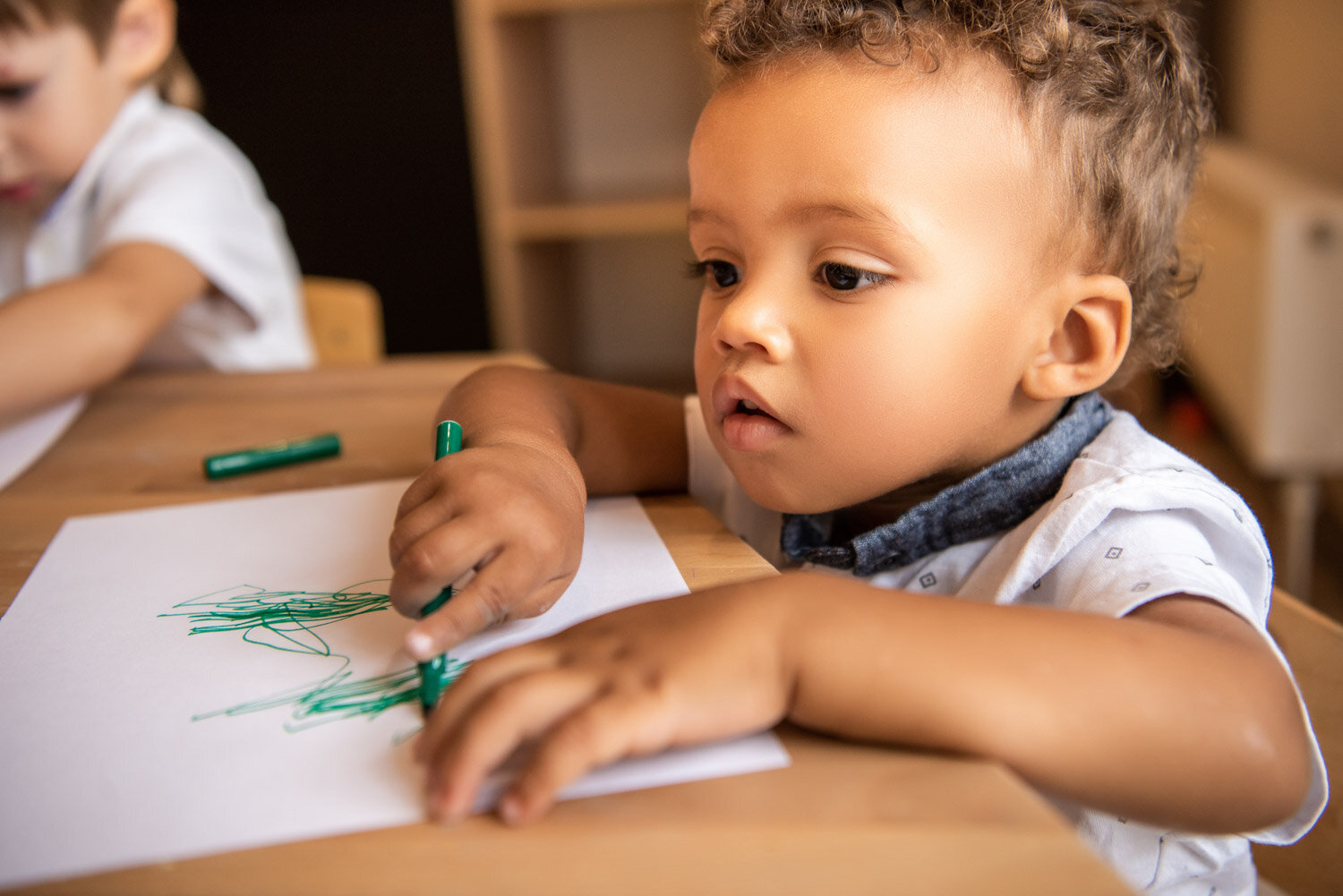 Caregiver reading a book with toddler