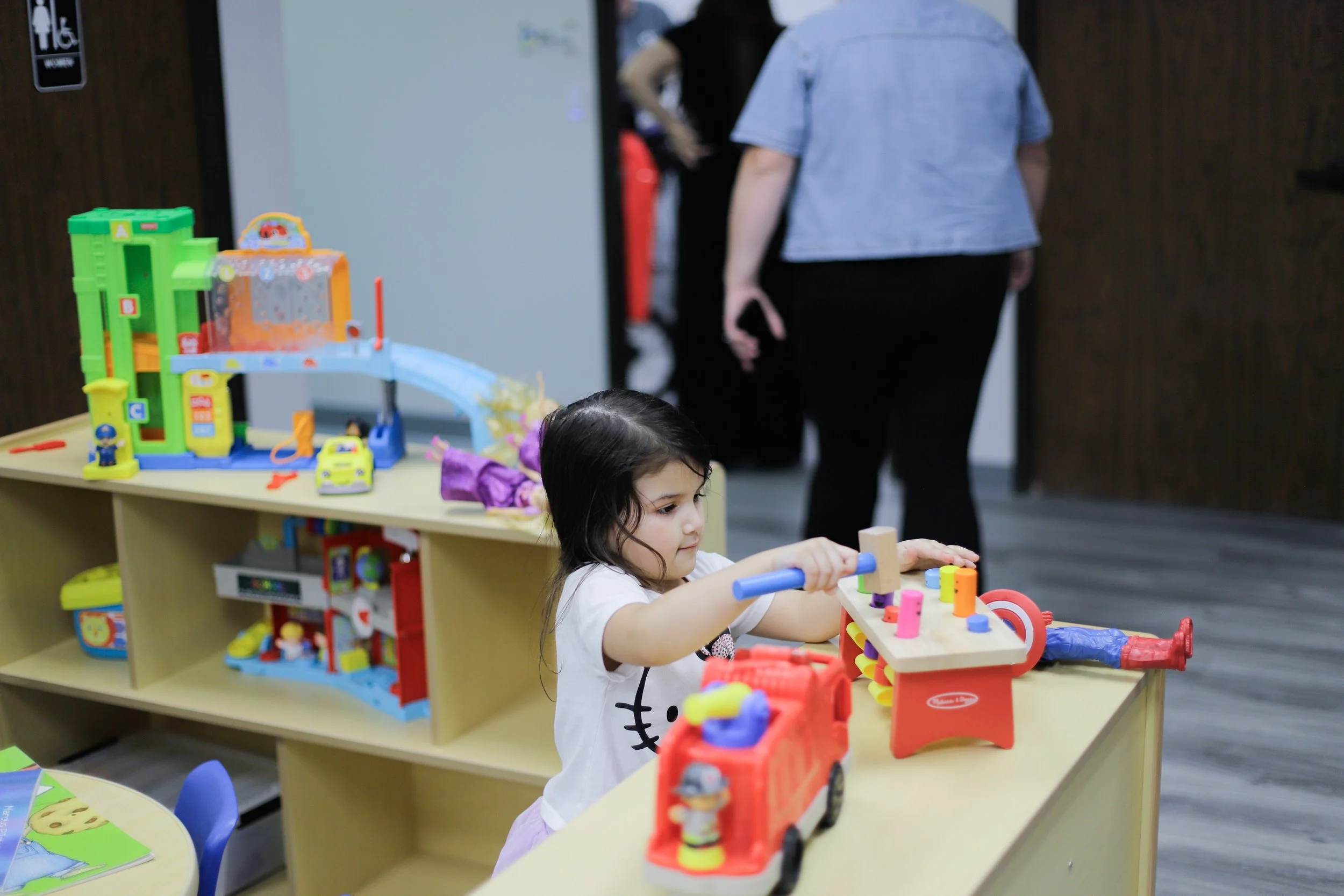 Child practicing play-based learning with ABA therapist at San Antonio autism care center