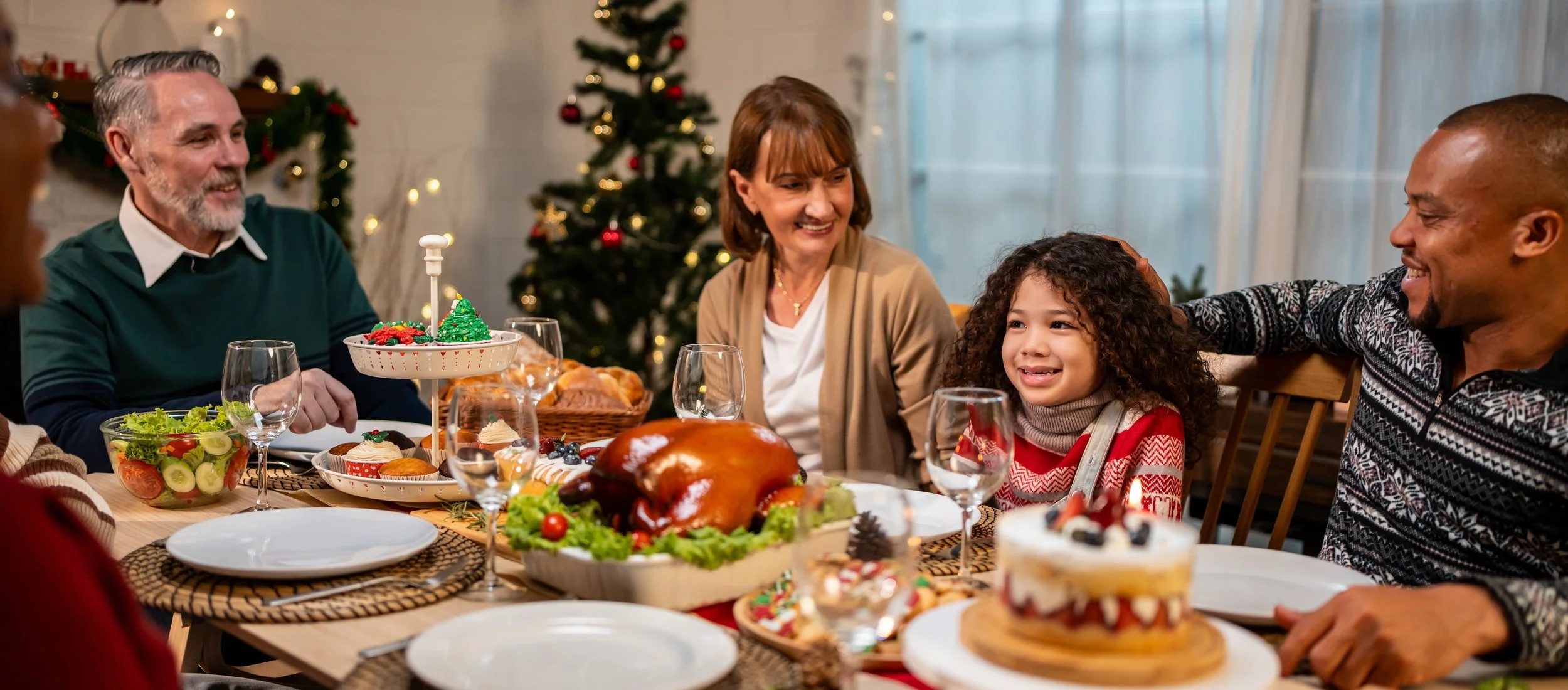 Child with autism enjoying a sensory-friendly family holiday gathering with headphones and comfort items, participating confidently in a supportive environment.