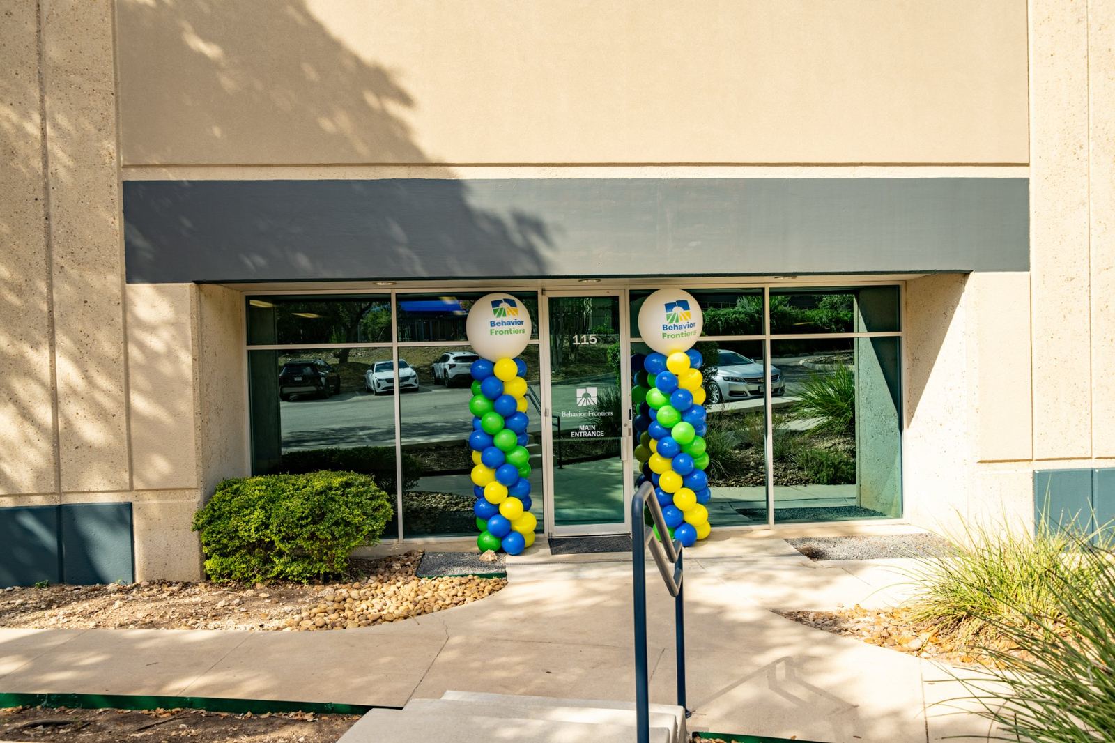 Main entrance of the fourth Behavior Frontiers autism center in San Antonio, decorated with branded balloons