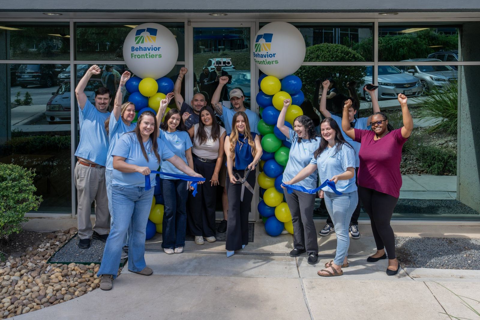 Behavior Frontiers team celebrating the grand opening ribbon cutting at their Fourth San Antonio autism center