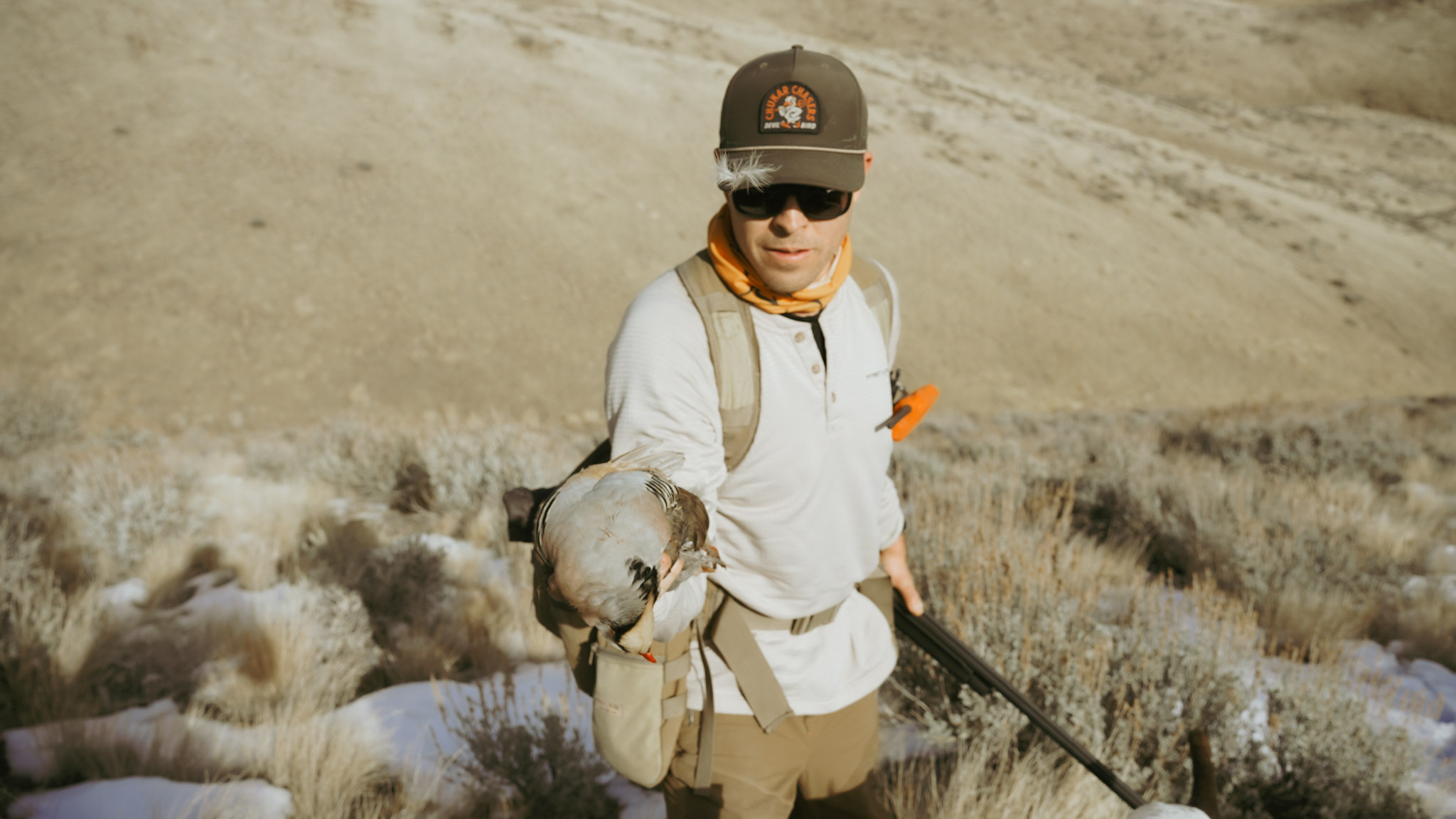 Hunter holding dead bird