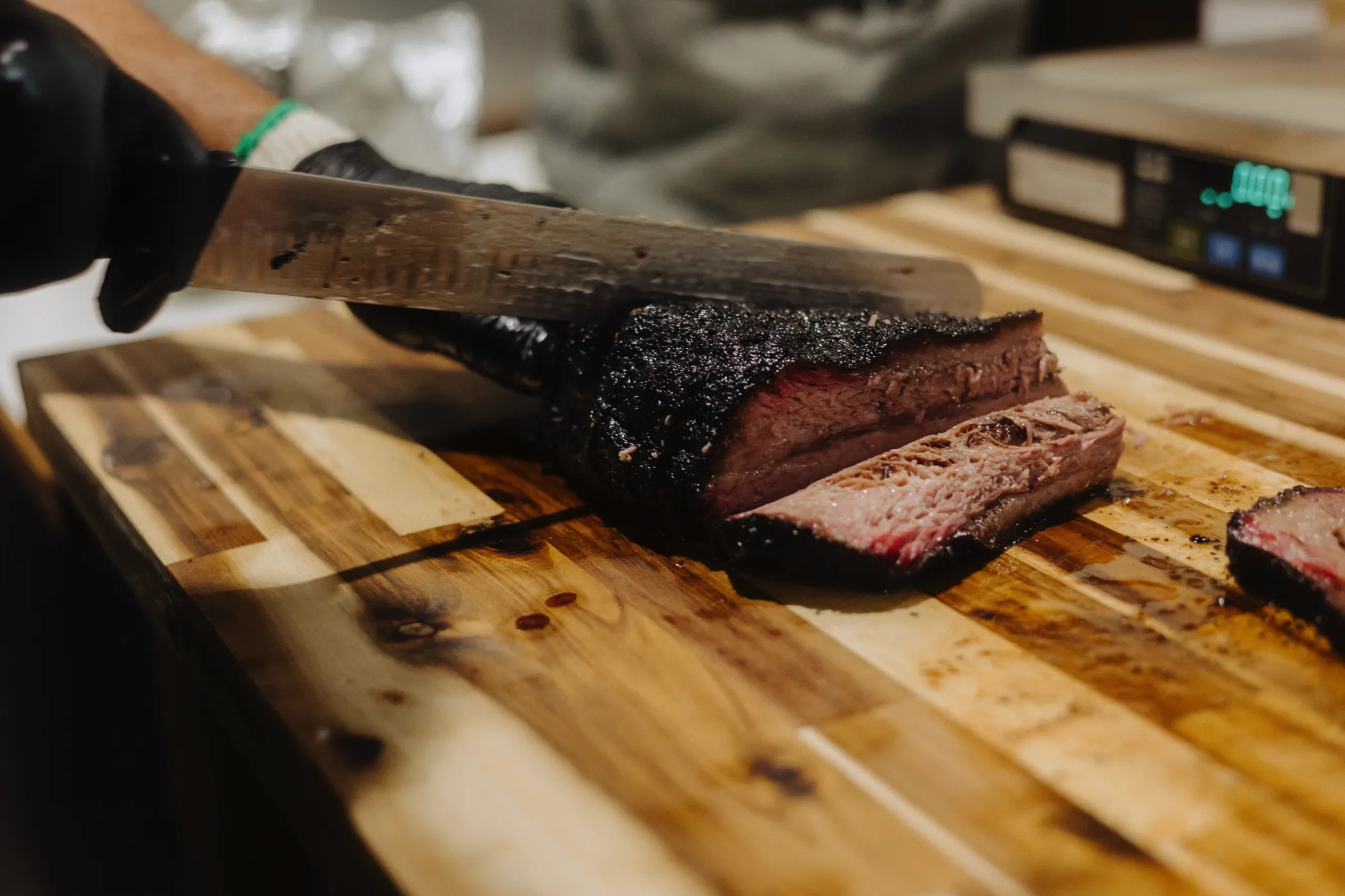 Smoked barbecue platter from Baare BBQ with sliced brisket and sides.