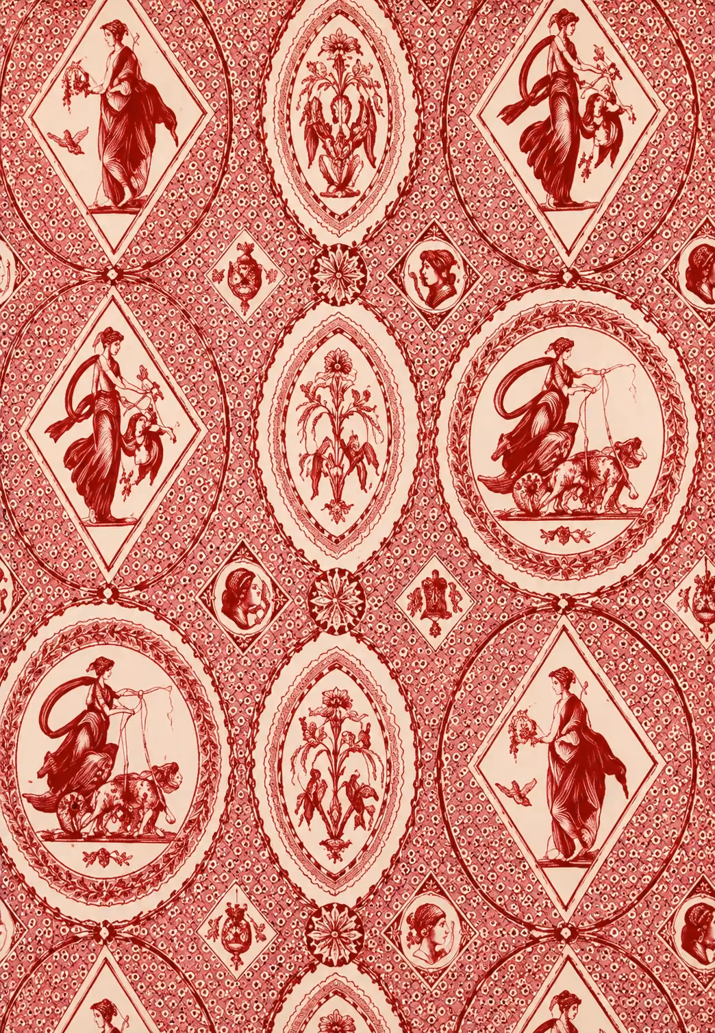 Red patterned fabric adorned with geometric medallions containing mythological figures.
