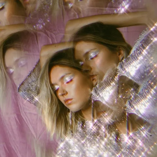 Person with glitter on clothing