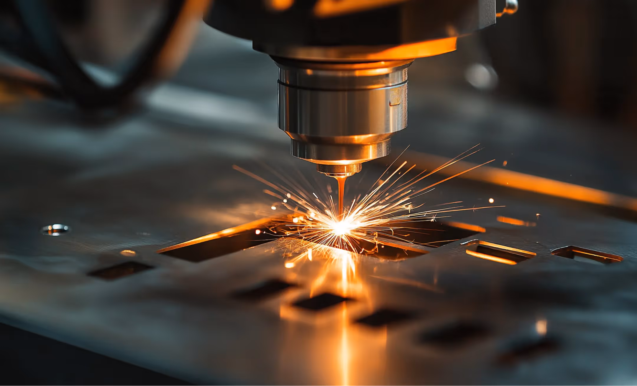 Close-up of a laser cutting machine igniting sparks while cutting metal sheet with rectangular shapes.