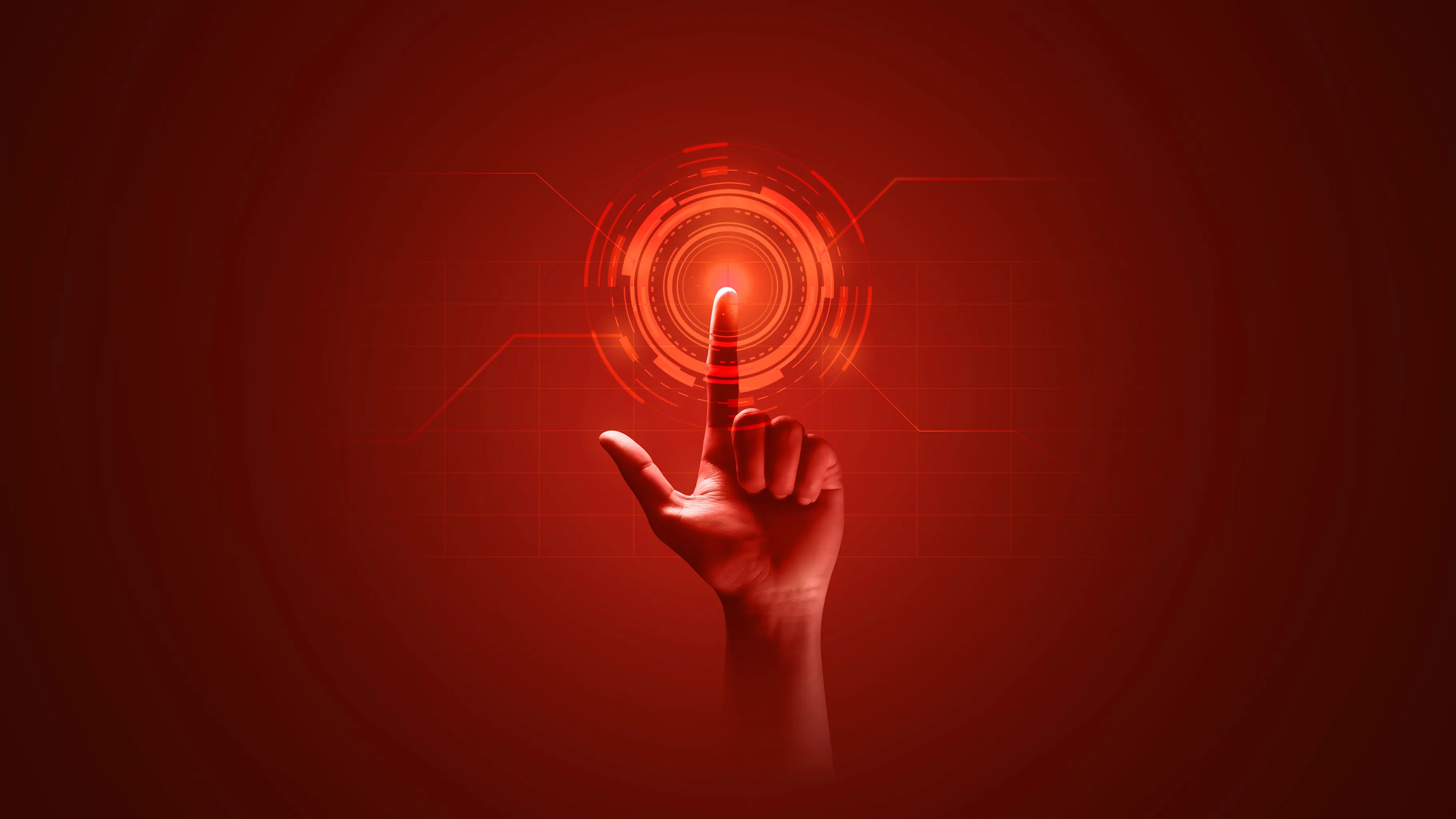 Hand with index finger touching a glowing red digital interface on a red background.