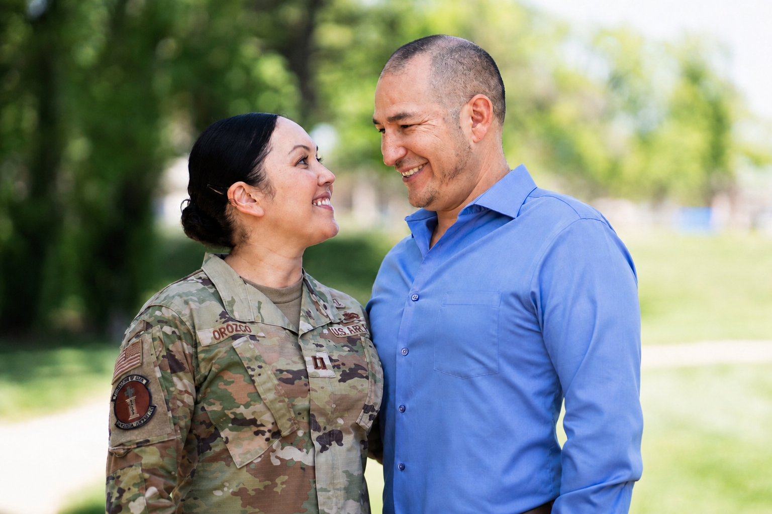 Air Force Capt. Jennifer Orozco and spouse Josue Orozco during a Military Spouse Appreciation Day photo at Travis Air Force Base. Their military family story reflects PCSUnited’s mission to help service members navigate PCS moves, housing decisions, and financial readiness with confidence.