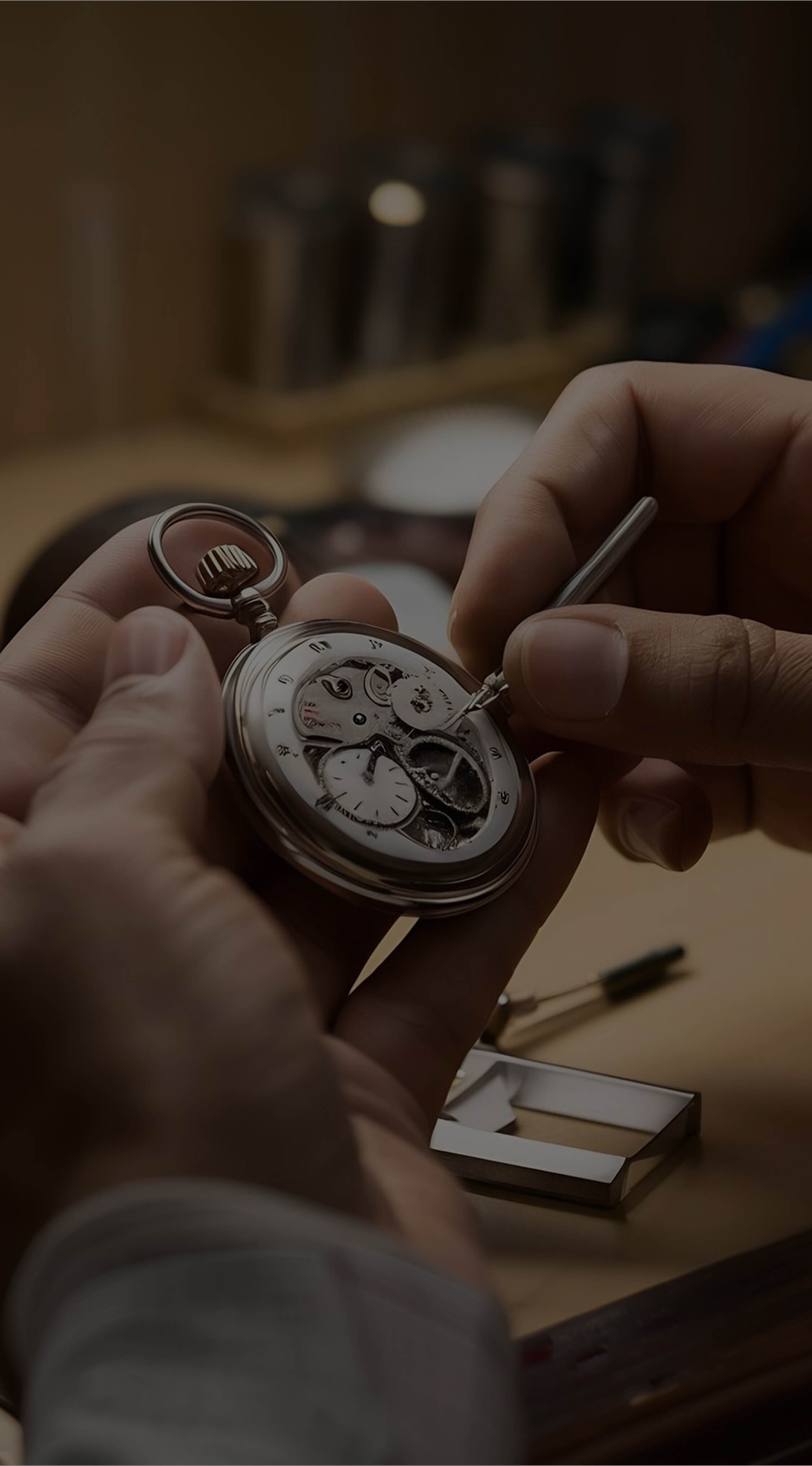 Person using small tool to repair or adjust a mechanical pocket watch movement.
