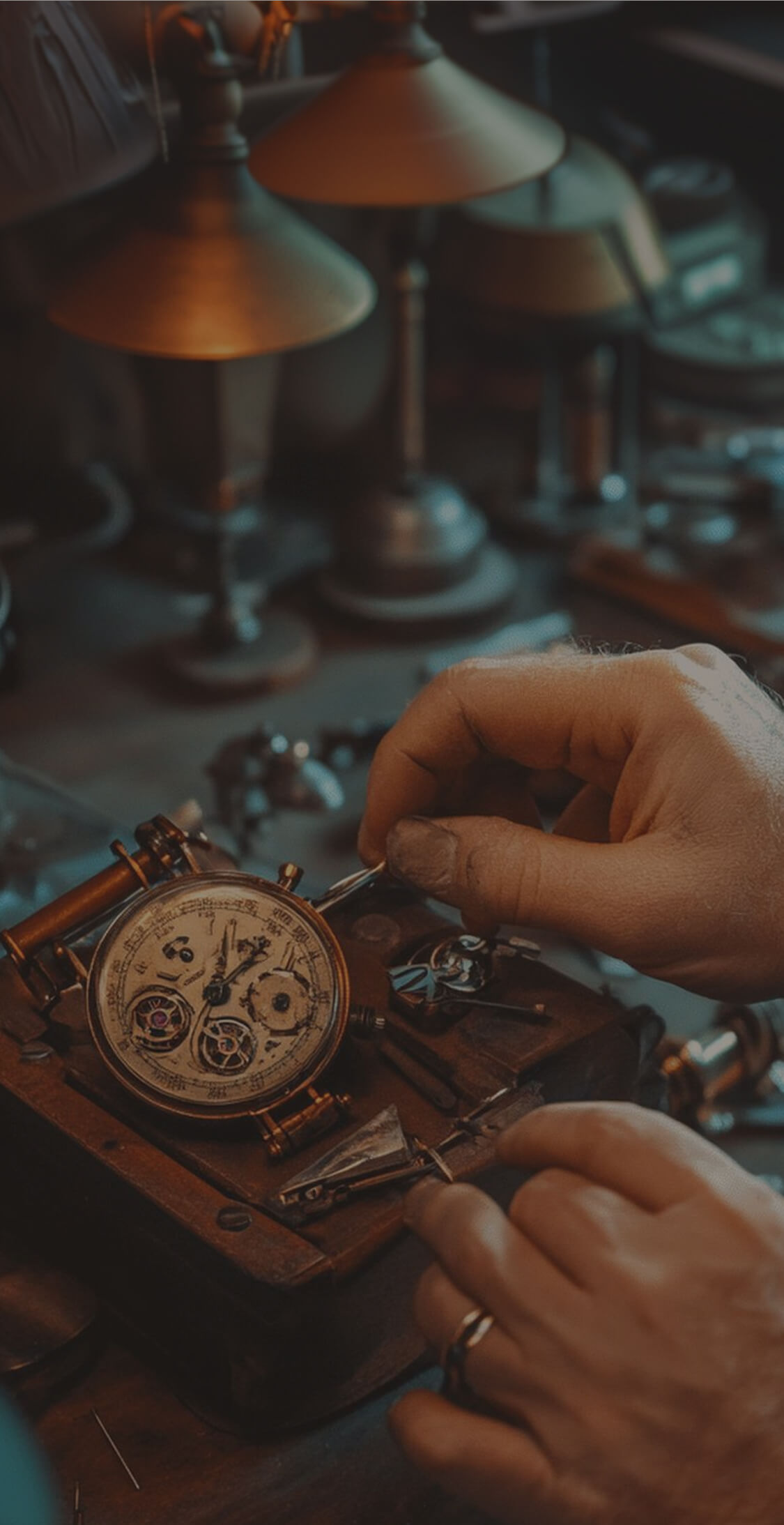 Close-up of hands repairing an antique pocket watch with intricate gears and tools on a workbench.