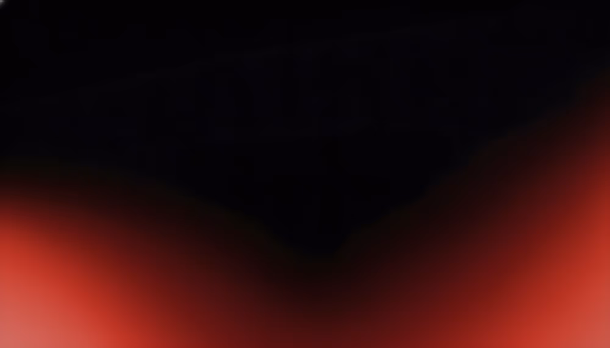A dark gradient background transitioning from solid black at the top to deep crimson red at the bottom, with the richest red concentrated along the lower edge and corners.