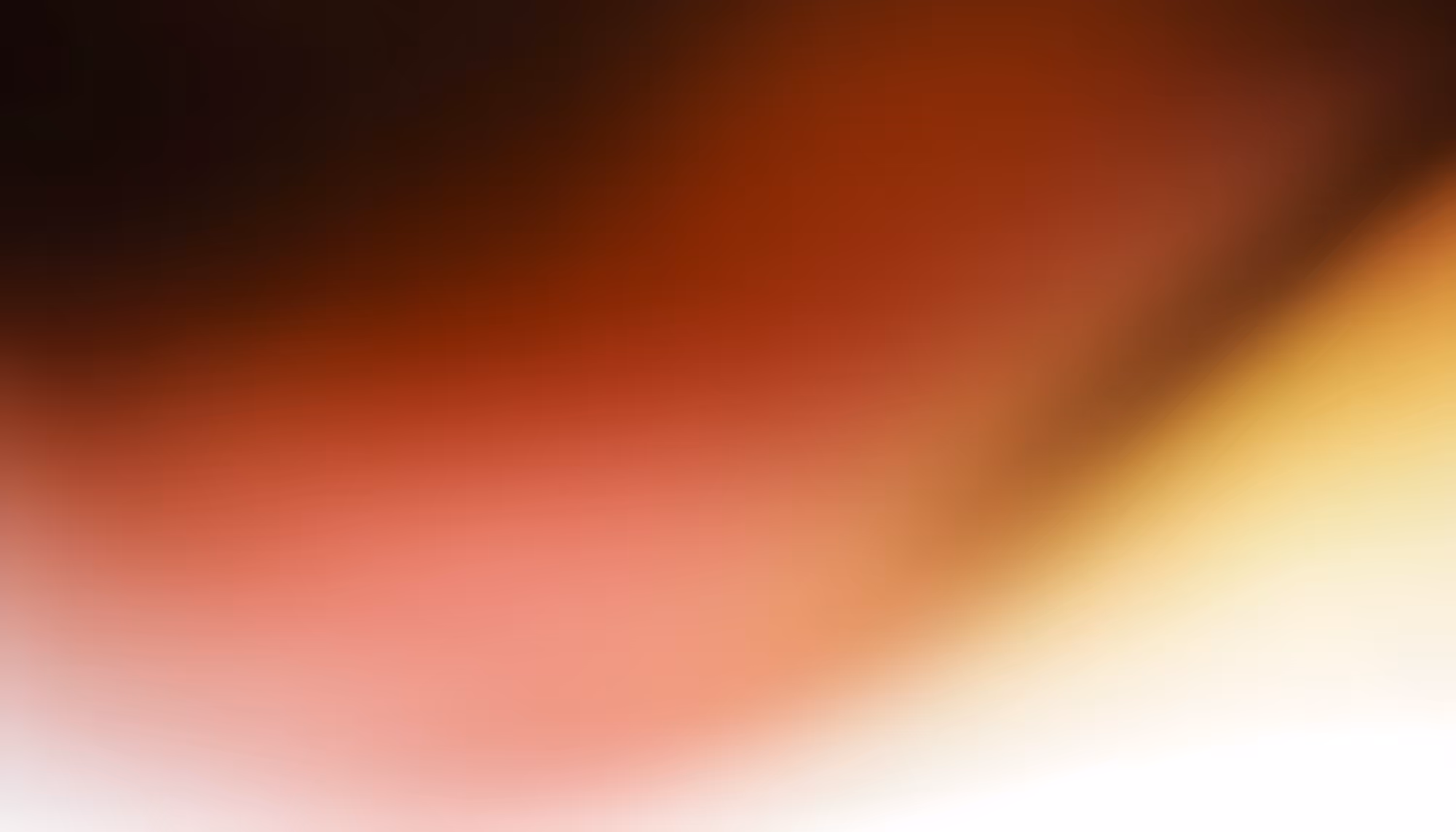 Abstract gradient blending deep black and dark red in the upper left, transitioning through warm crimson and soft pink tones in the center, with a diagonal sweep of golden yellow fading to white in the lower right corner.