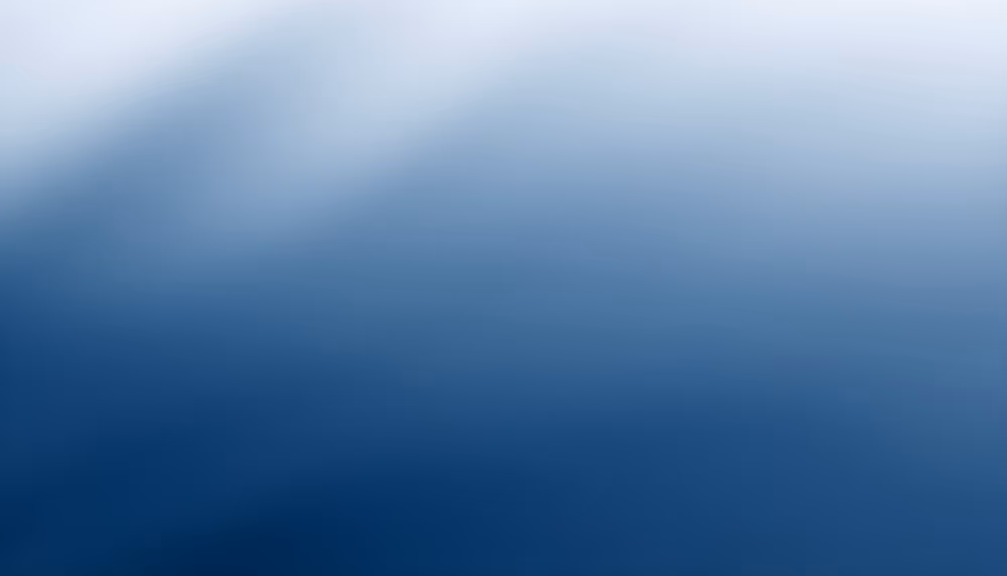 A heavily blurred abstract image transitioning from pale silvery-blue at the top to deep navy blue at the bottom, suggesting an out-of-focus sky or water scene.