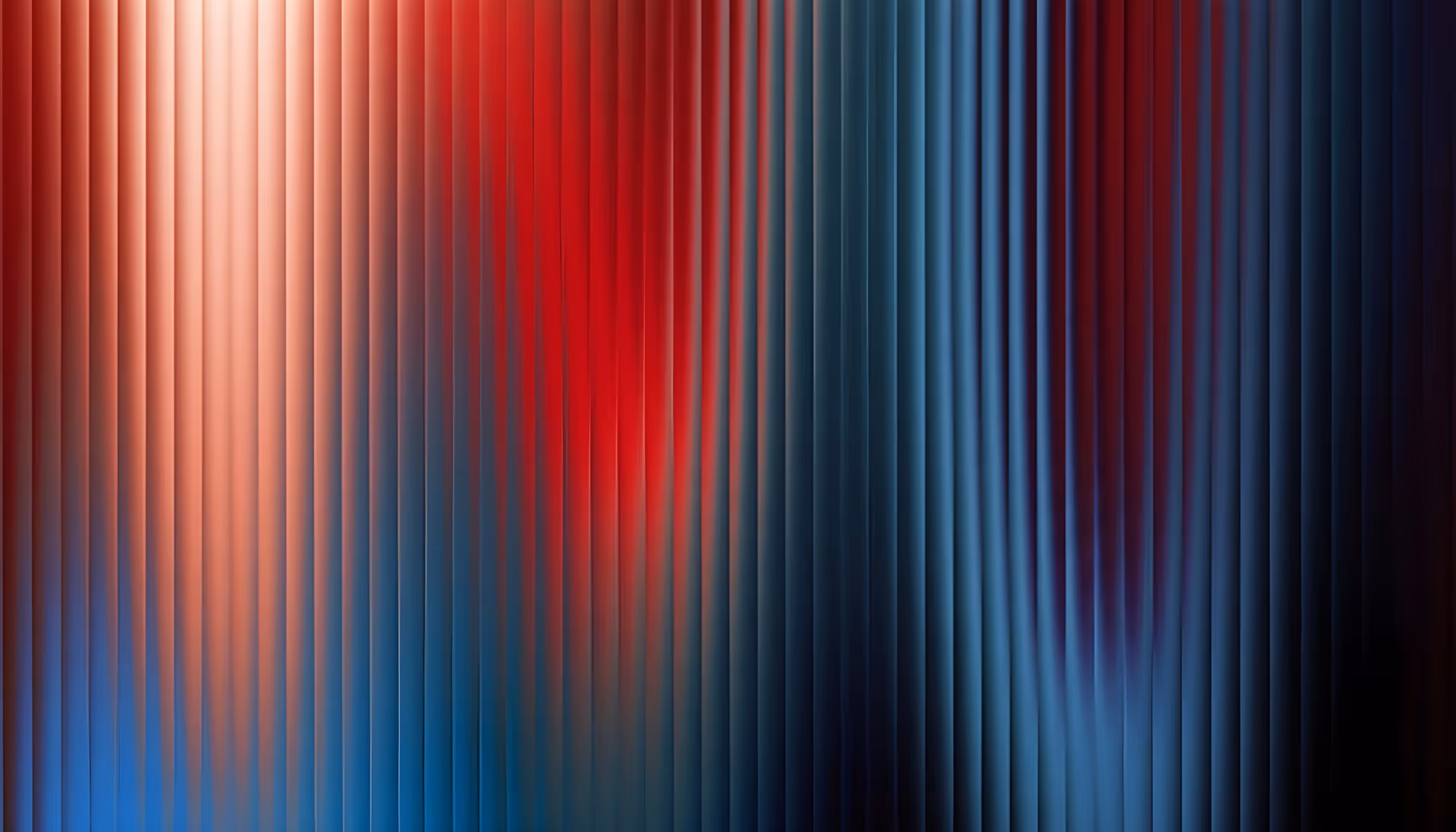 Abstract vertical striped pattern transitioning from warm pink and red tones on the left to cool steel blue and dark navy on the right, with soft lighting effects creating a gradient shimmer across the stripes.