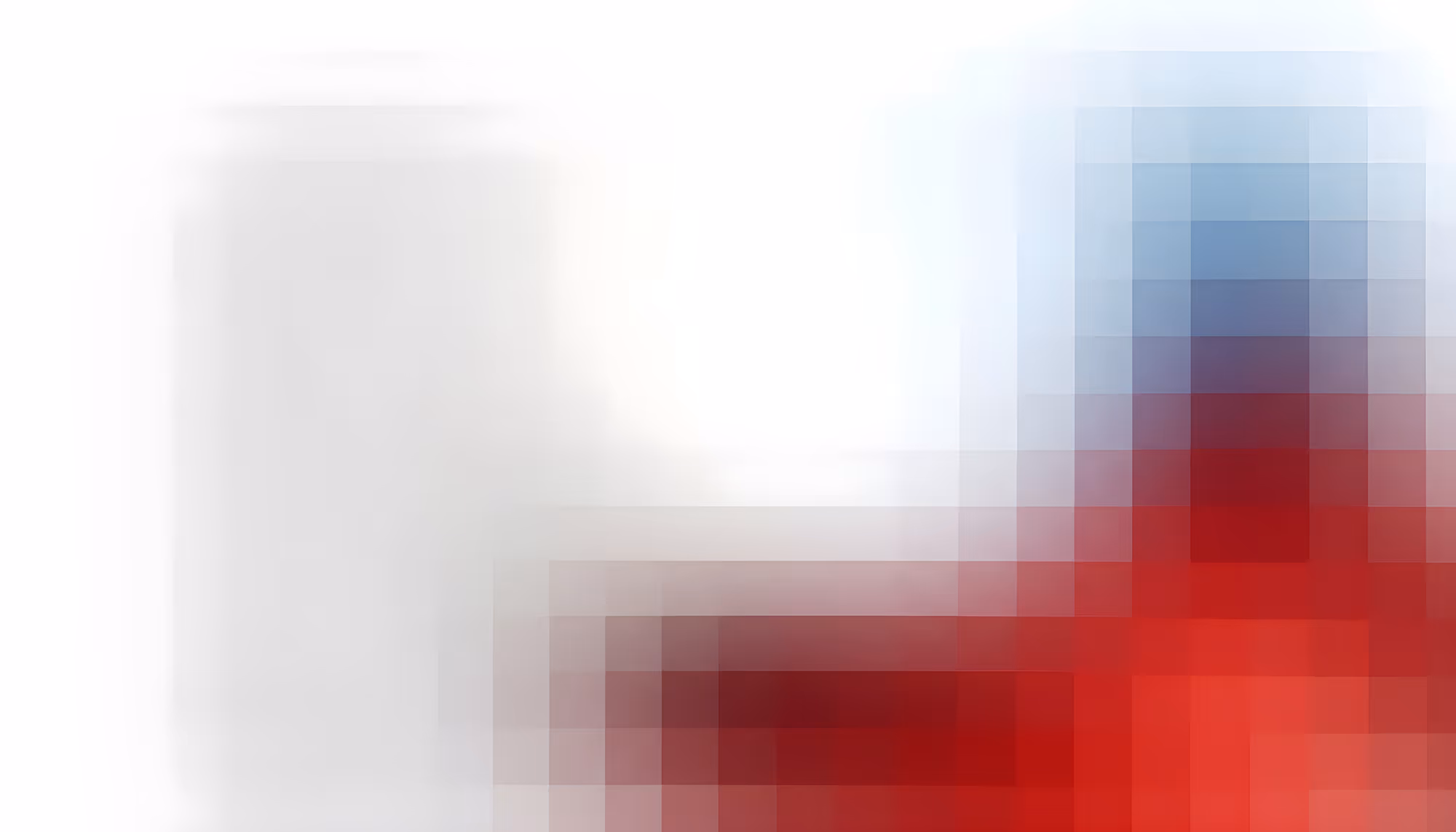 Heavily pixelated and blurred abstract image with a white and light gray area on the left transitioning to bold red tones on the right, with a hint of blue-gray in the upper right corner.