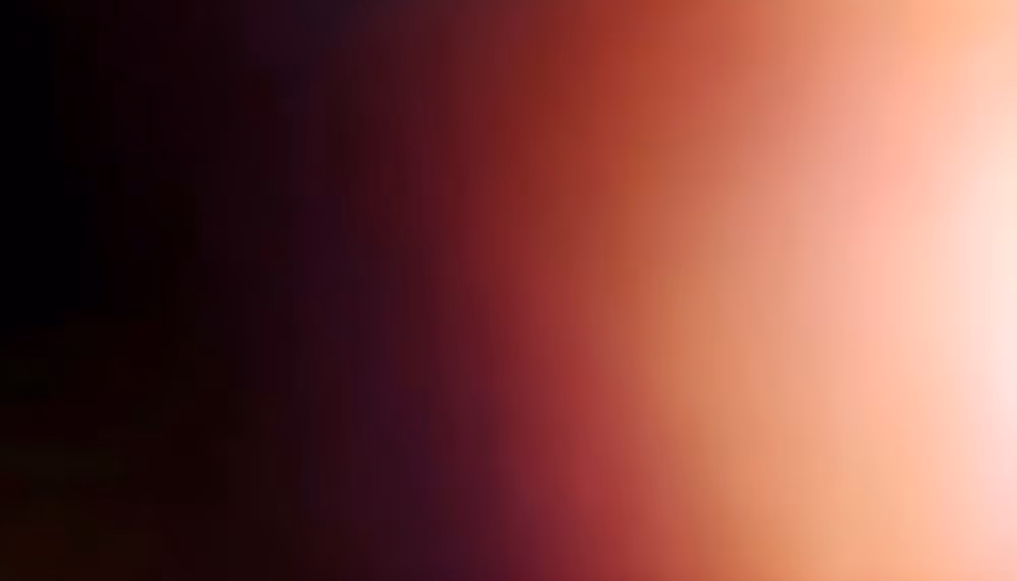 A smooth gradient transitioning from deep black on the left through dark maroon and crimson red in the center to warm peach and soft white on the right.