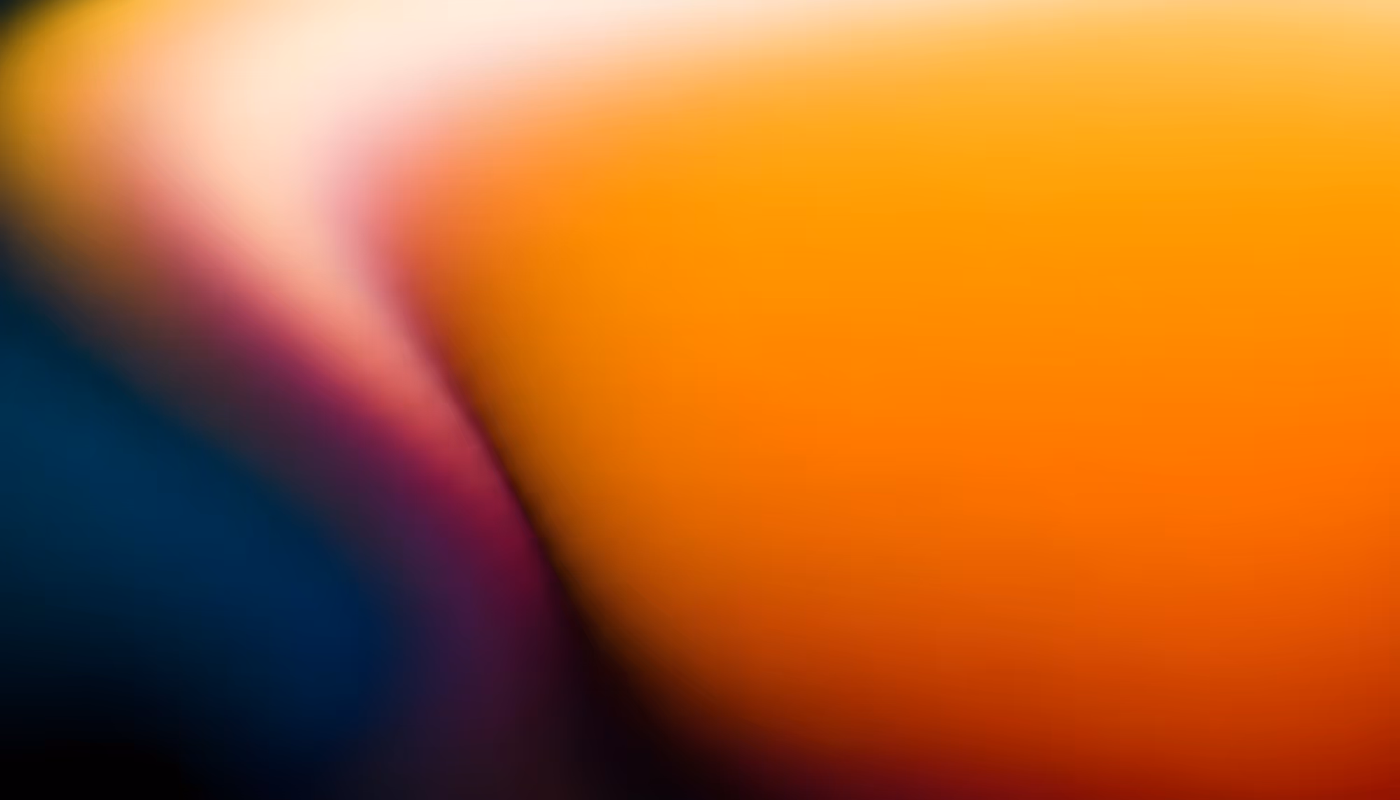 Abstract gradient image with warm amber and orange tones dominating the right side, transitioning to deep teal and navy on the left, with a bright white-pink highlight and magenta streak cutting diagonally across the center.