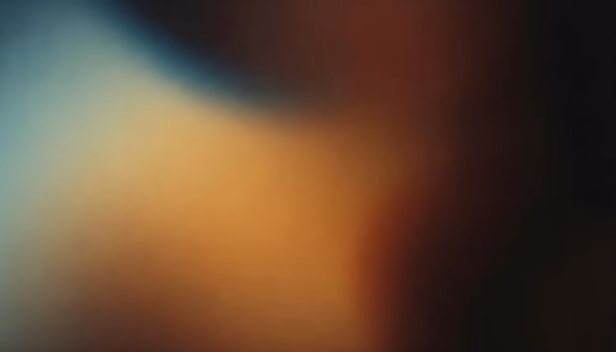 Abstract image with soft, blurred gradients of blue, orange, and brown. The colors blend smoothly, creating a calm and soothing atmosphere.