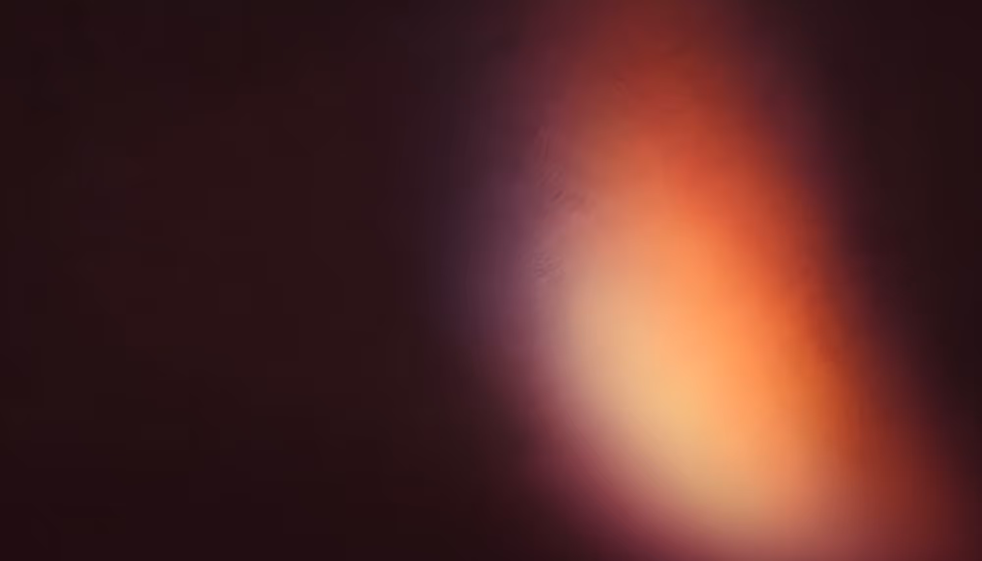 Abstract image with a warm gradient, blending dark brown with vibrant orange and subtle purple hues, evoking a sense of warmth and mystery.