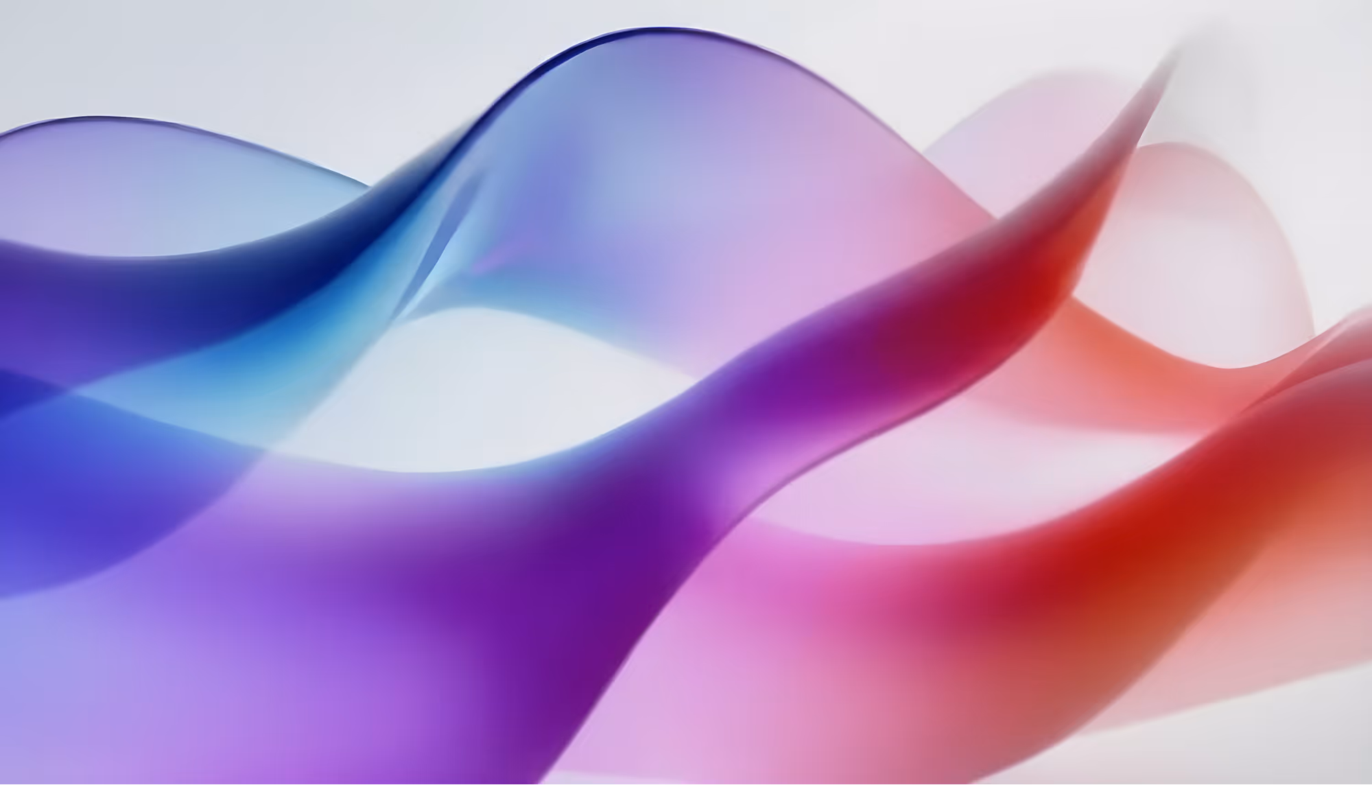 Abstract image of flowing, translucent waves in purple, blue, and red hues against a soft white background, evoking a sense of calm and motion.