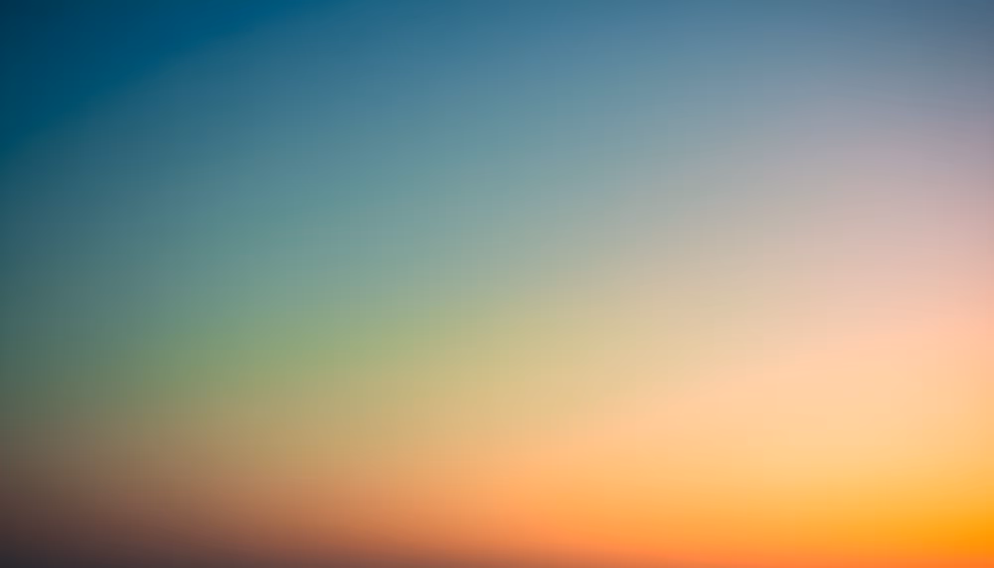 A serene gradient featuring soft blues, greens, yellows, and oranges, evoking a peaceful, calming sunset or sunrise in an abstract style.