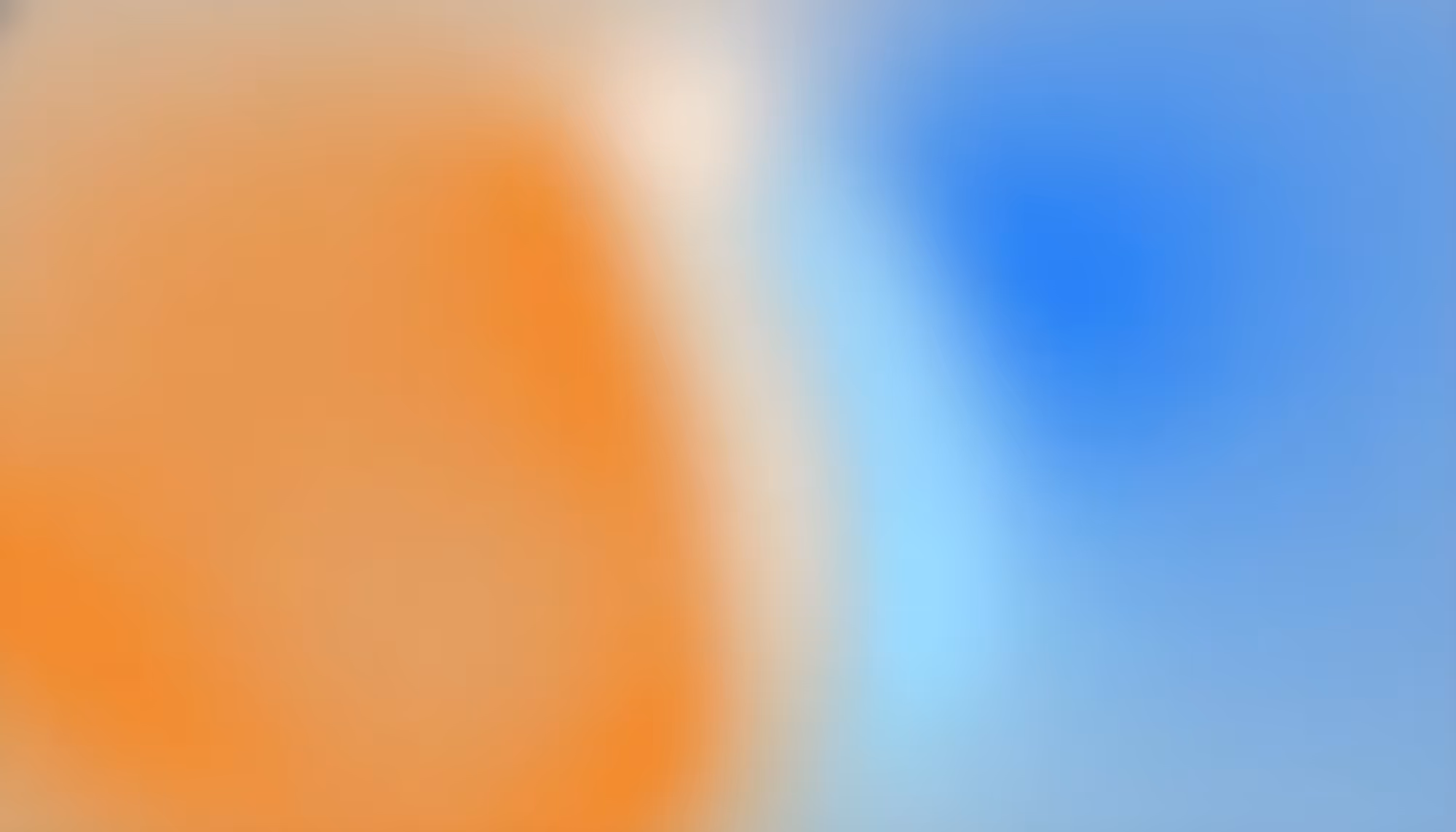 Abstract image featuring a blend of soft, blurred colors; a large orange area on the left merges with a blue area on the right, creating a serene atmosphere.
