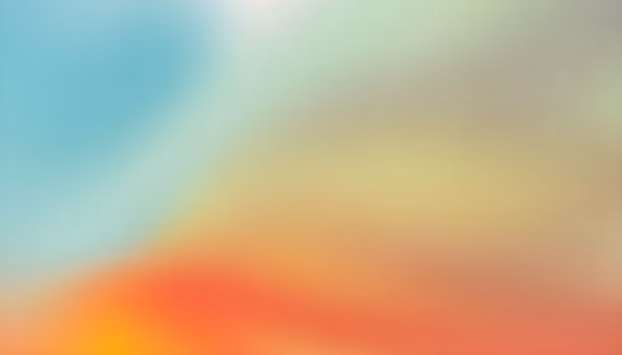 A soft, colorful abstract background with blended hues of blue, yellow, and red. The tones merge smoothly, creating a calm, dreamy atmosphere.