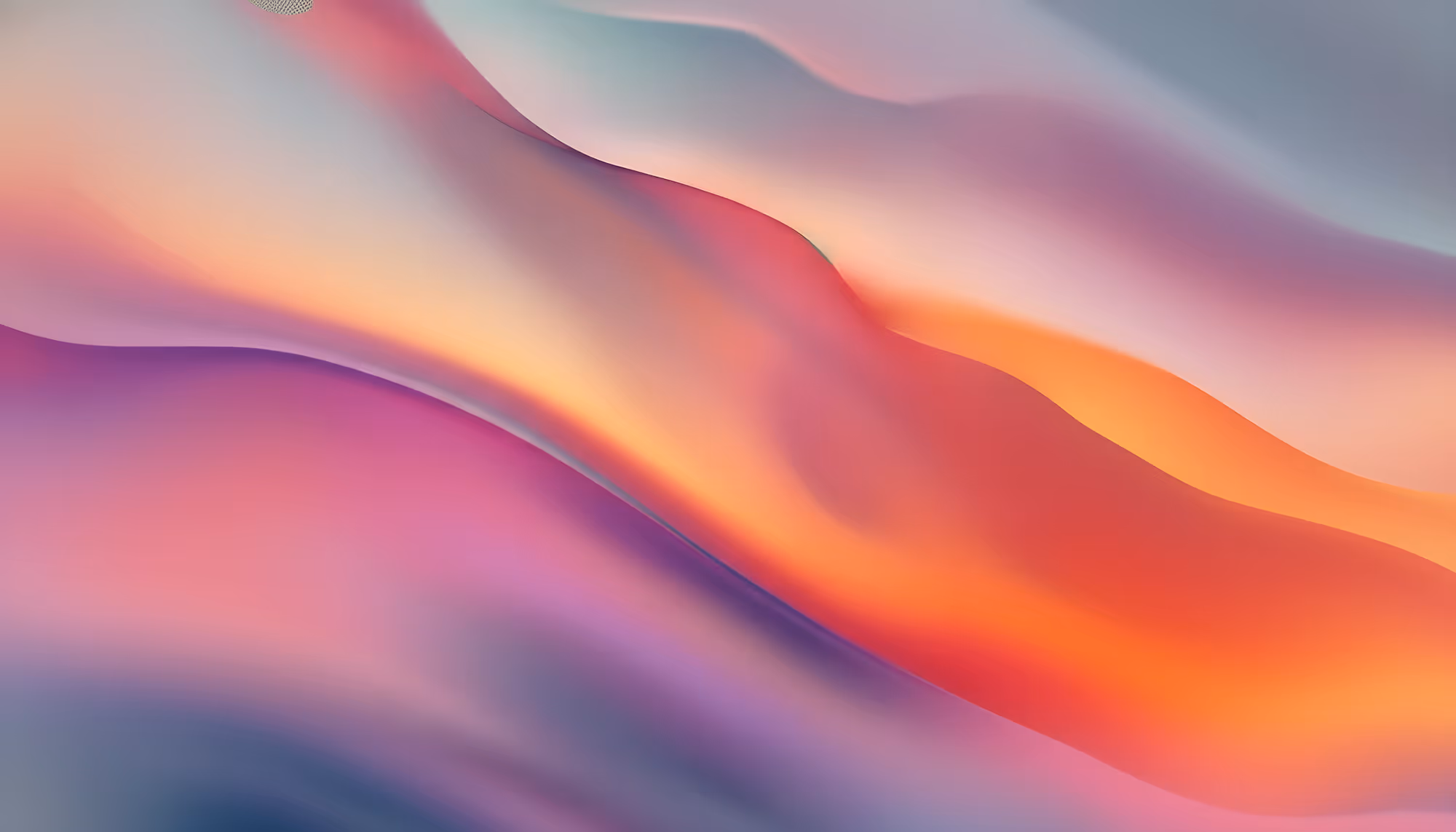 A vibrant abstract image with smooth, flowing waves of purple, pink, orange, and blue gradients. The calming, fluid motion conveys a serene and dreamy mood.