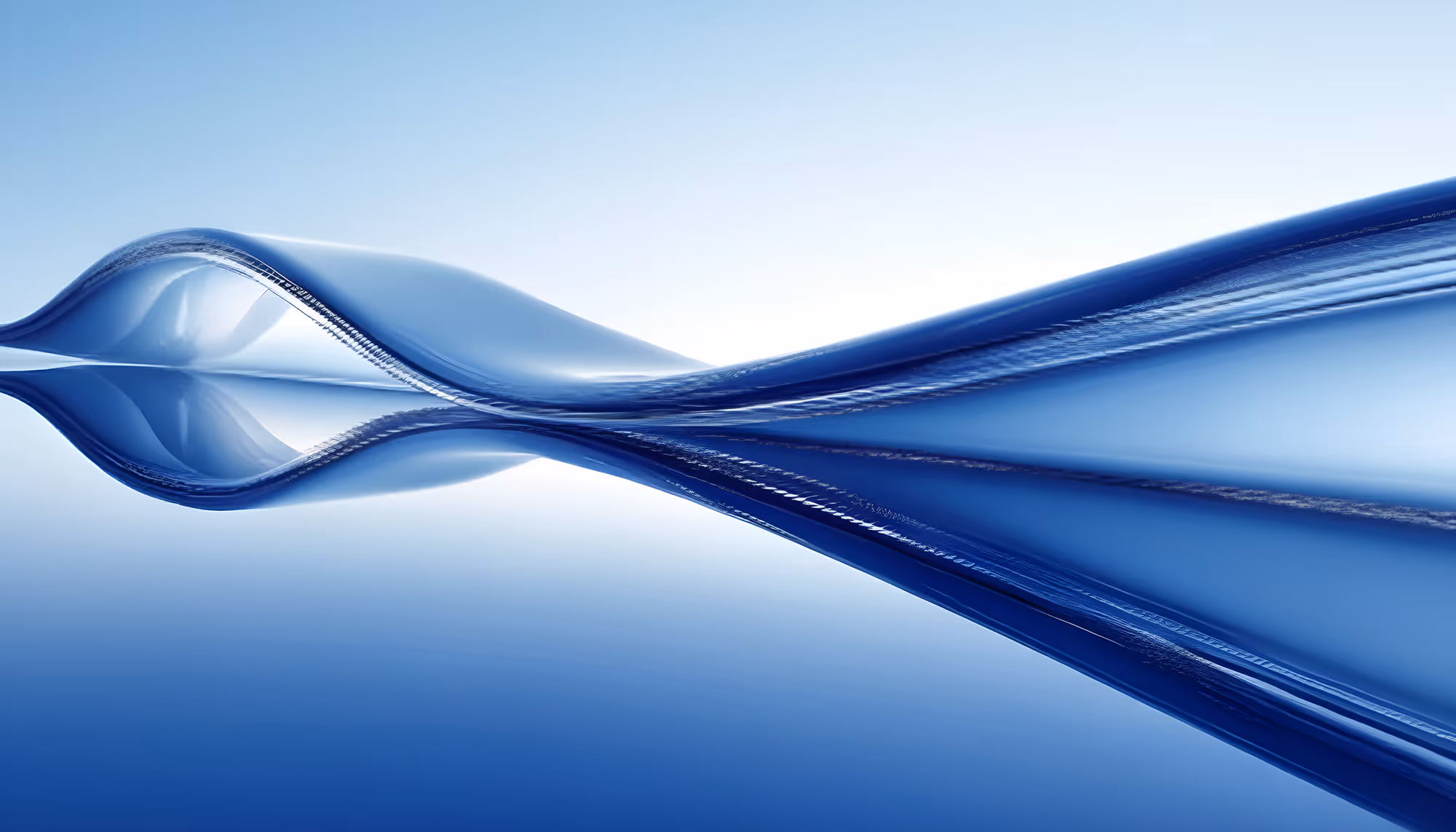 Abstract image of smooth, flowing blue waves against a light blue background, creating an elegant and serene atmosphere with a sense of fluidity.