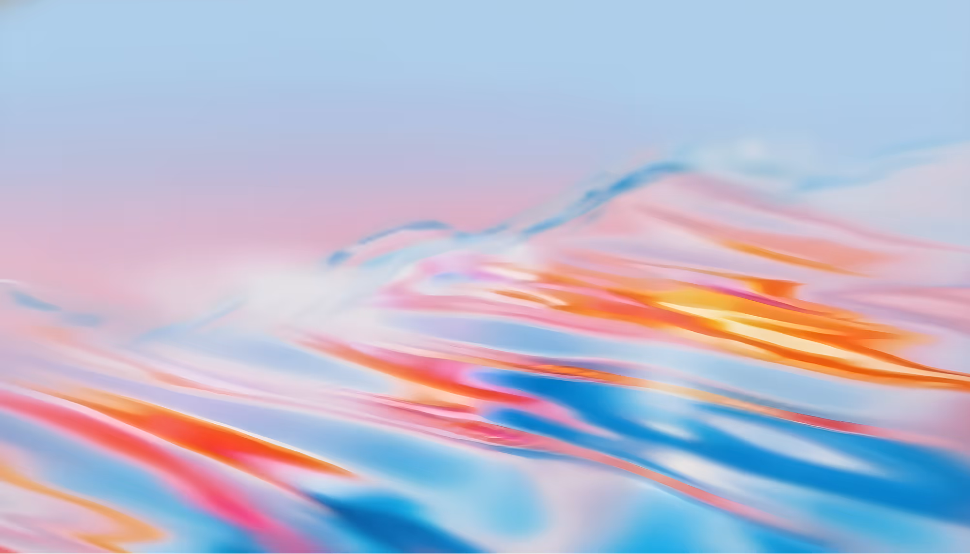 Abstract image featuring a blend of pastel waves in blue, pink, and orange hues against a soft sky-like background, conveying a calm, dreamy ambiance.
