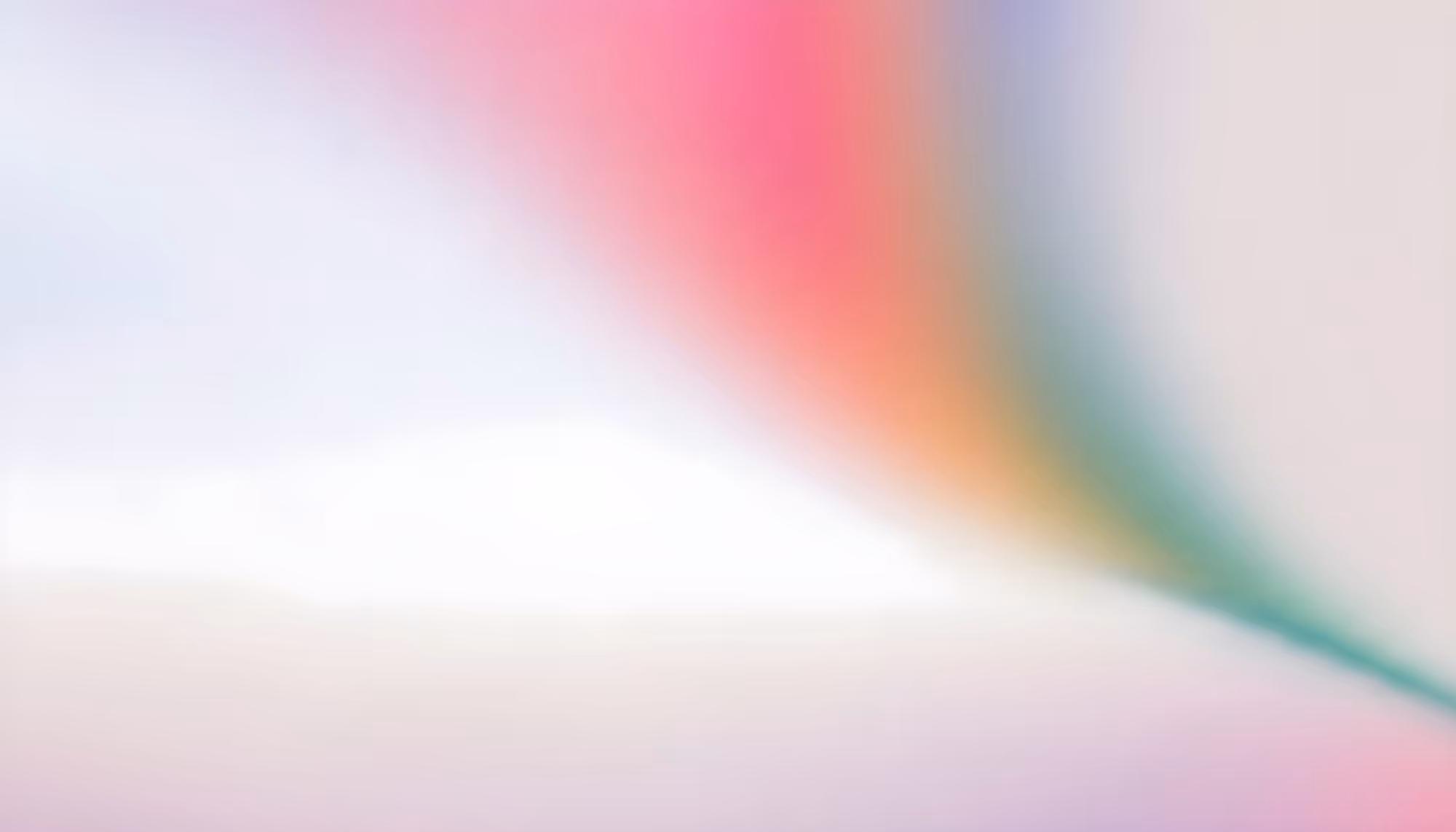 Abstract blurred image featuring soft pastel colors blending seamlessly; pink, blue, and green hues create a tranquil and dreamy atmosphere.